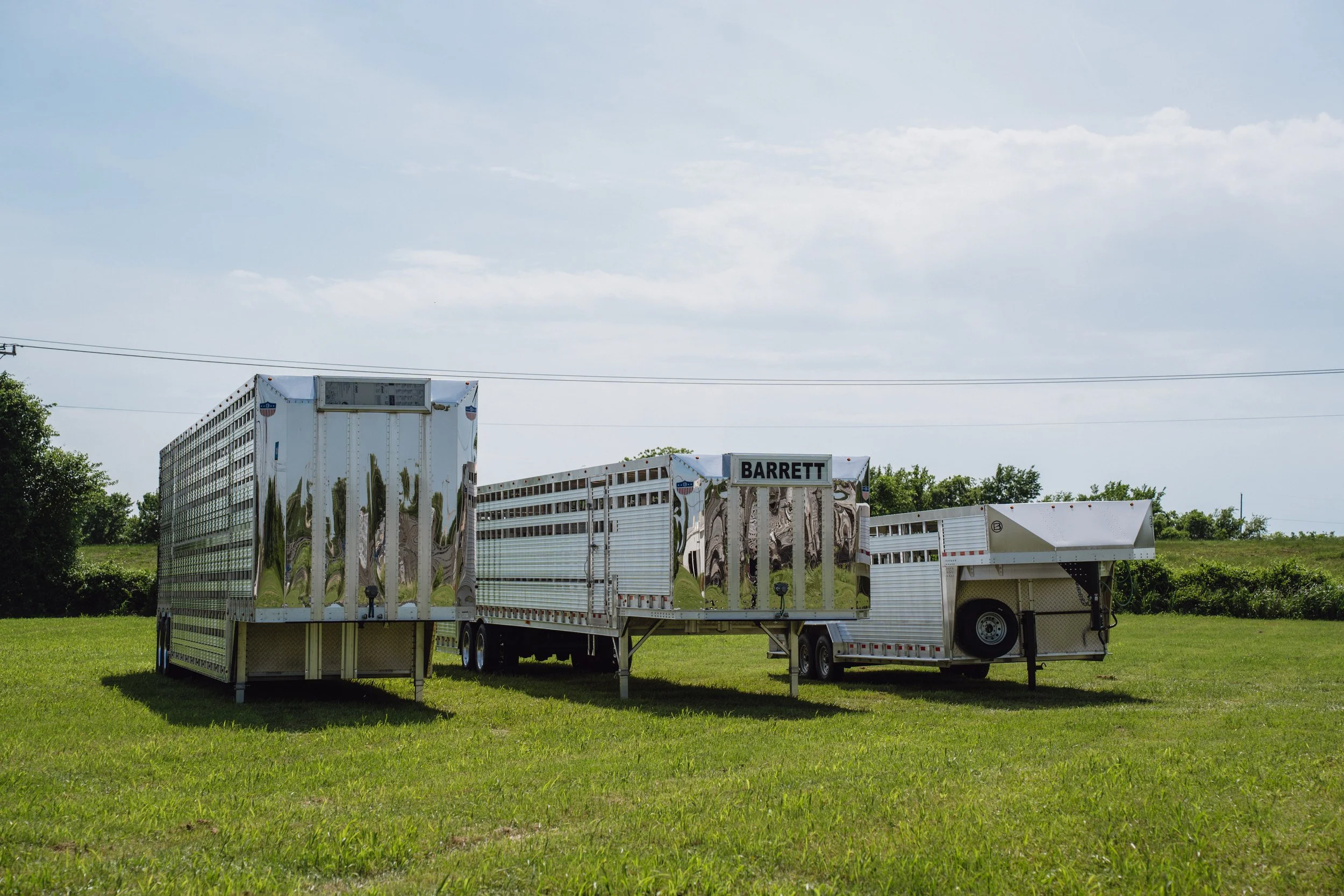 Multiple cattle trailers parked and ready for hauling