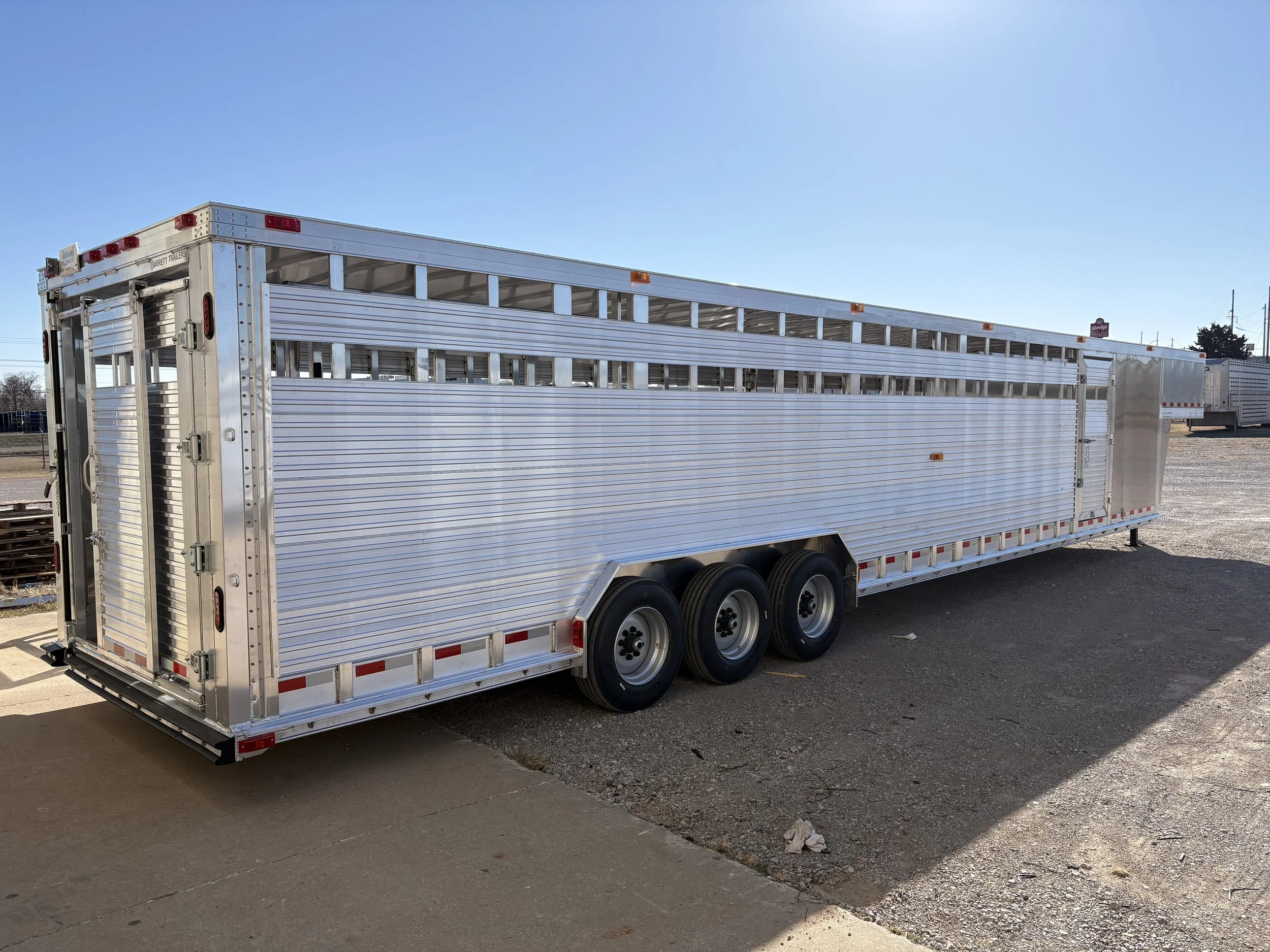 Aluminum Barrett gooseneck cattle trailer with multiple livestock compartments