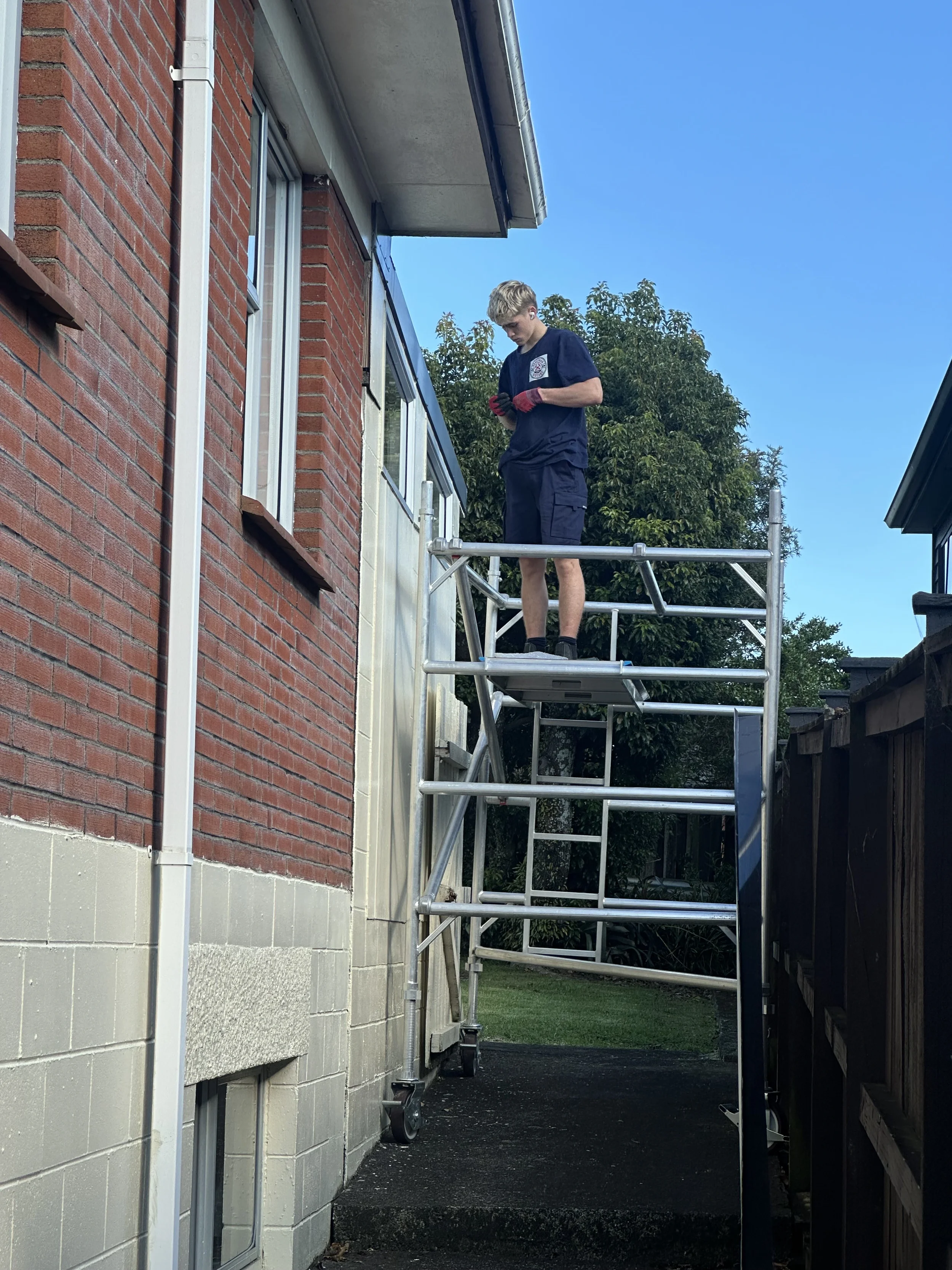 New exterior window flashing being installed during a leak repair project in Botany