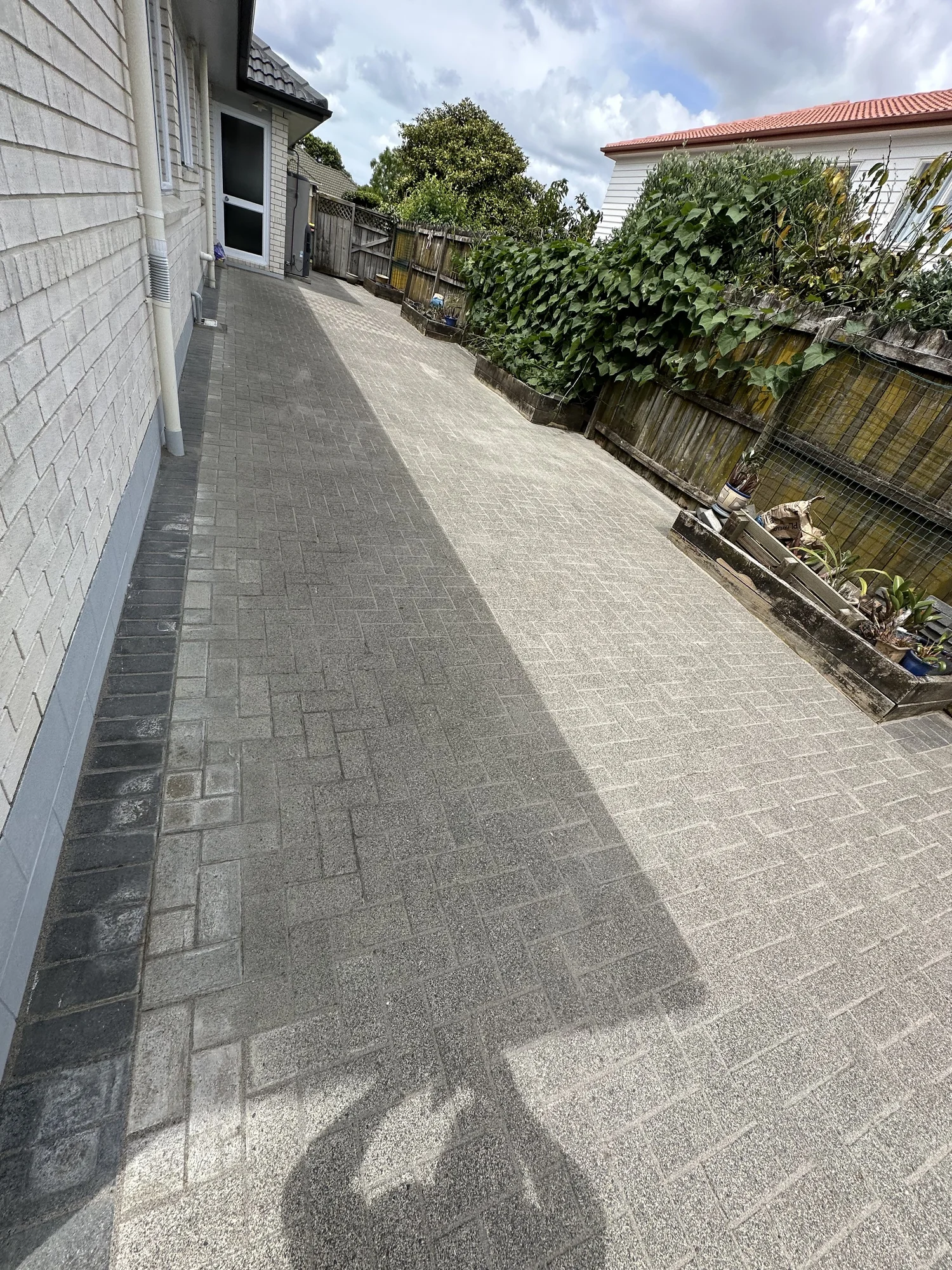 Finished Golflands courtyard paving with cleaned surface and restored paving joints