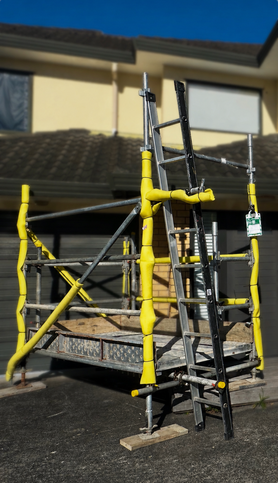 Mobile scaffold set up for a soffit repair project at a residential property in Pakuranga, Auckland. Safe access equipment used for exterior home maintenance and soffit repairs.
