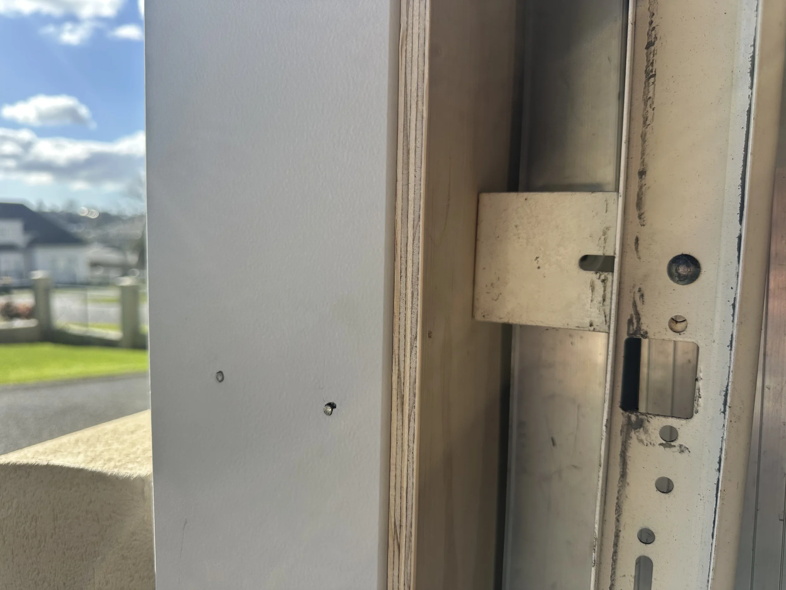 Garage door mounting bracket securely refitted after installation of the new timber architrave