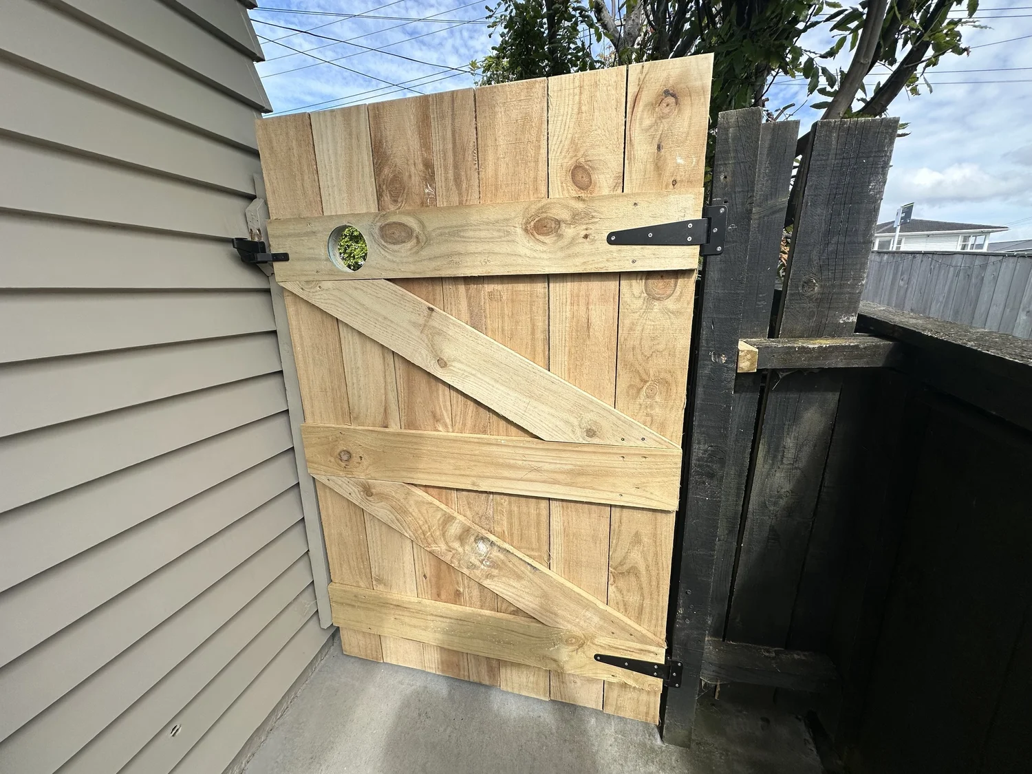 Timber palings fitted and trimmed to height on a custom garden gate in Shelly Park