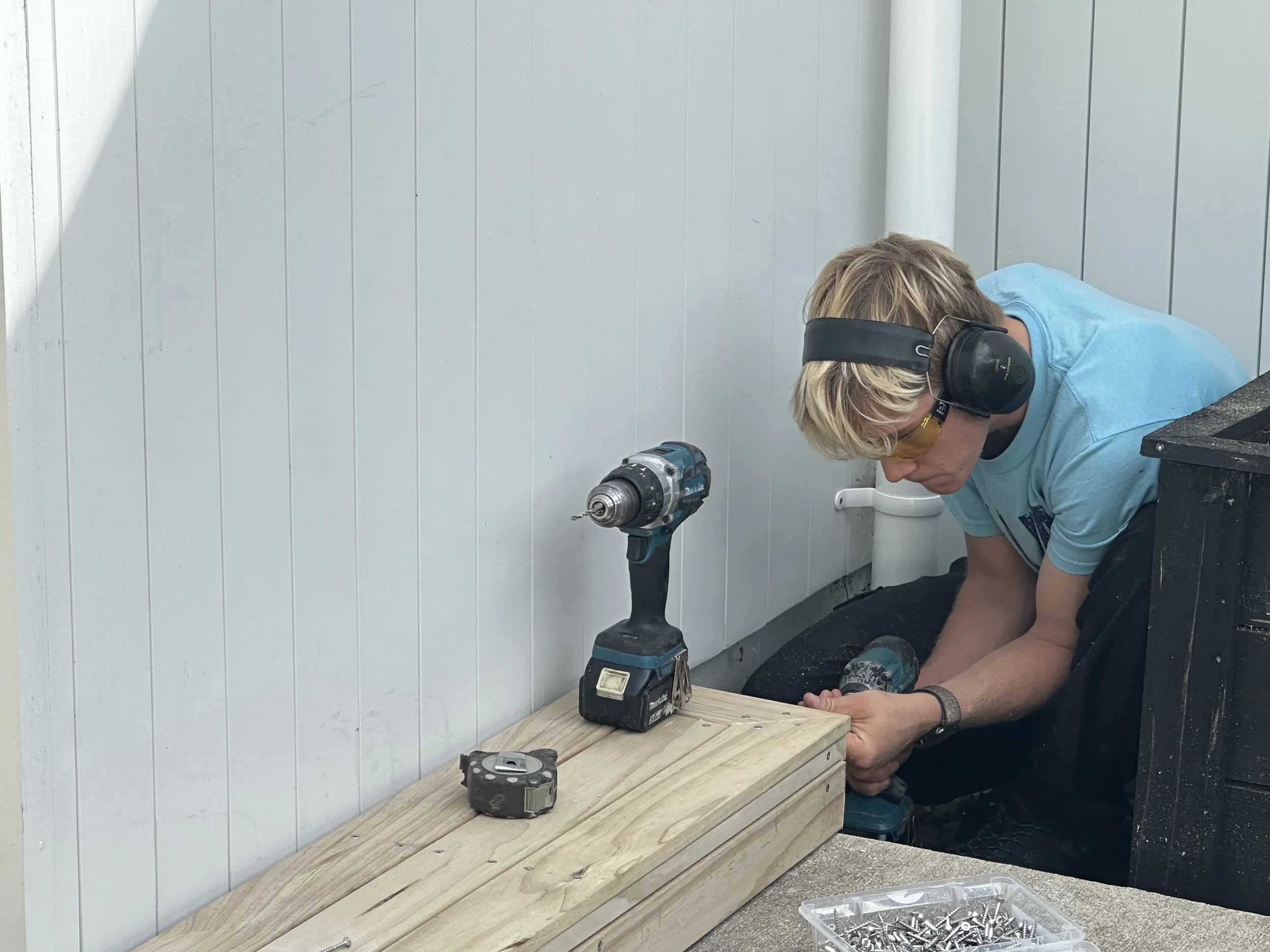 Side boxing and timber trim being installed around a new deck in Cockle Bay, February 2026