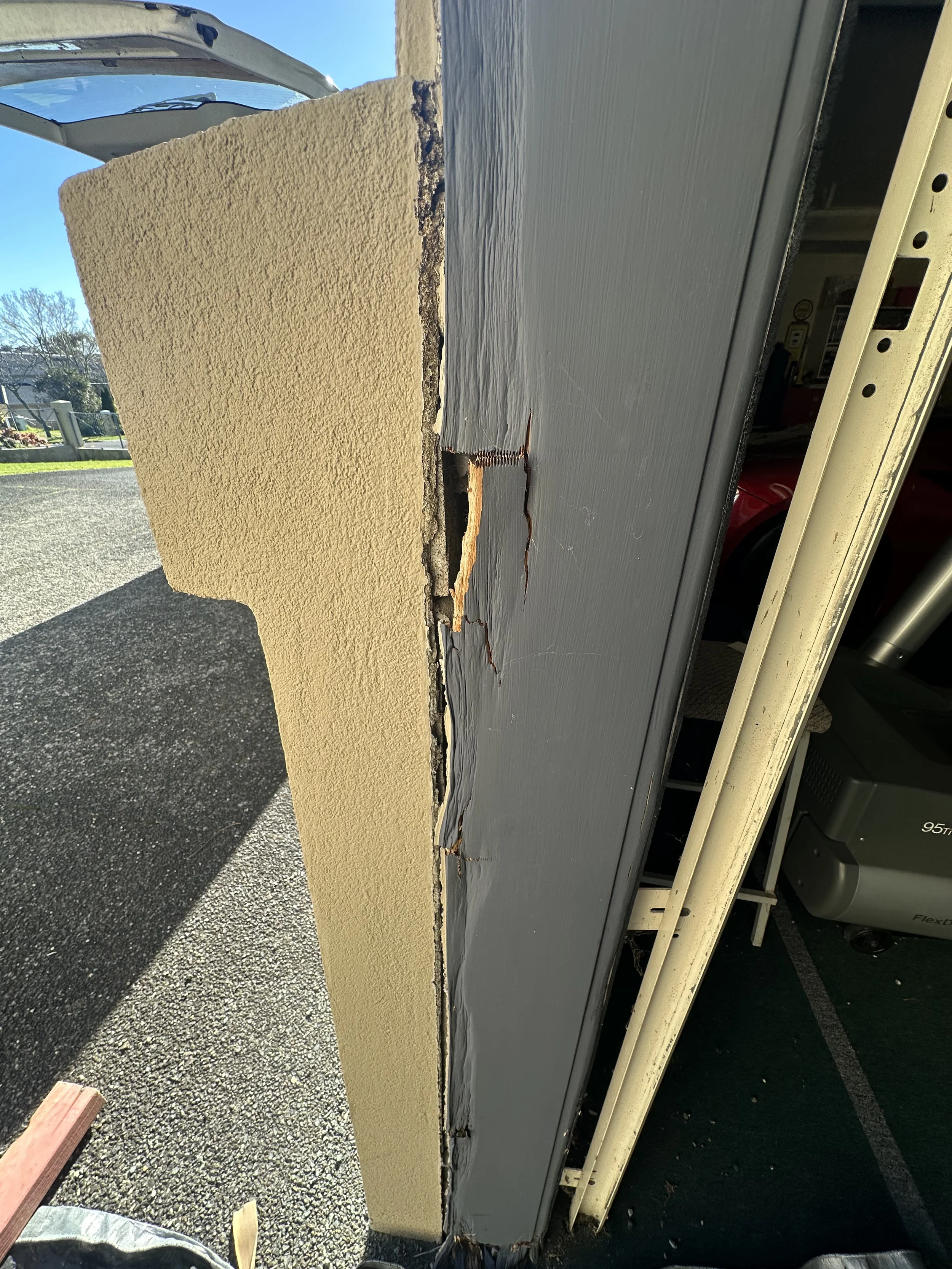 Rotten and damaged timber in the side garage door jamb before replacement in Somerville