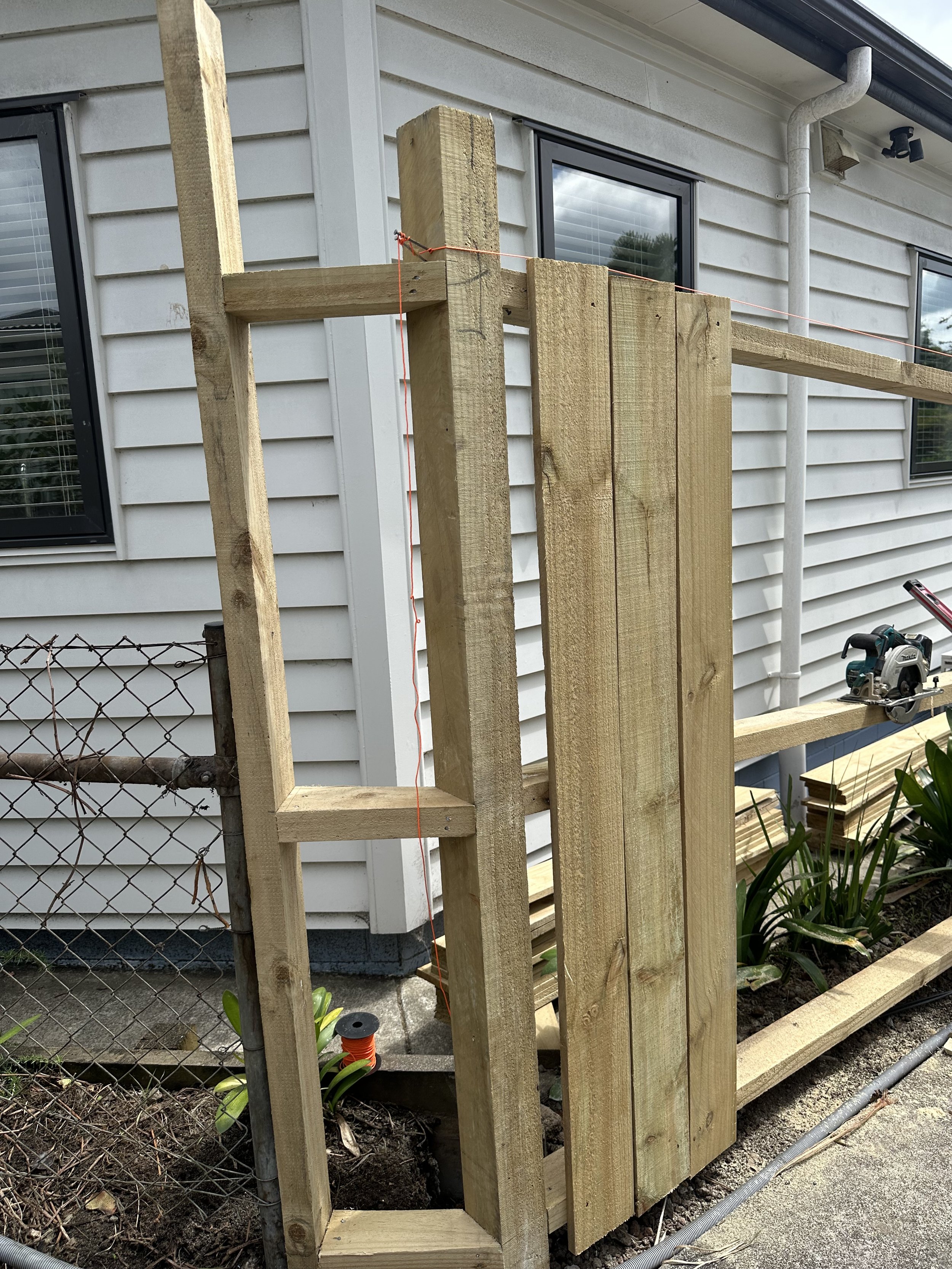 Close-up of new timber fence framing and post connection during fence installation in Pakuranga