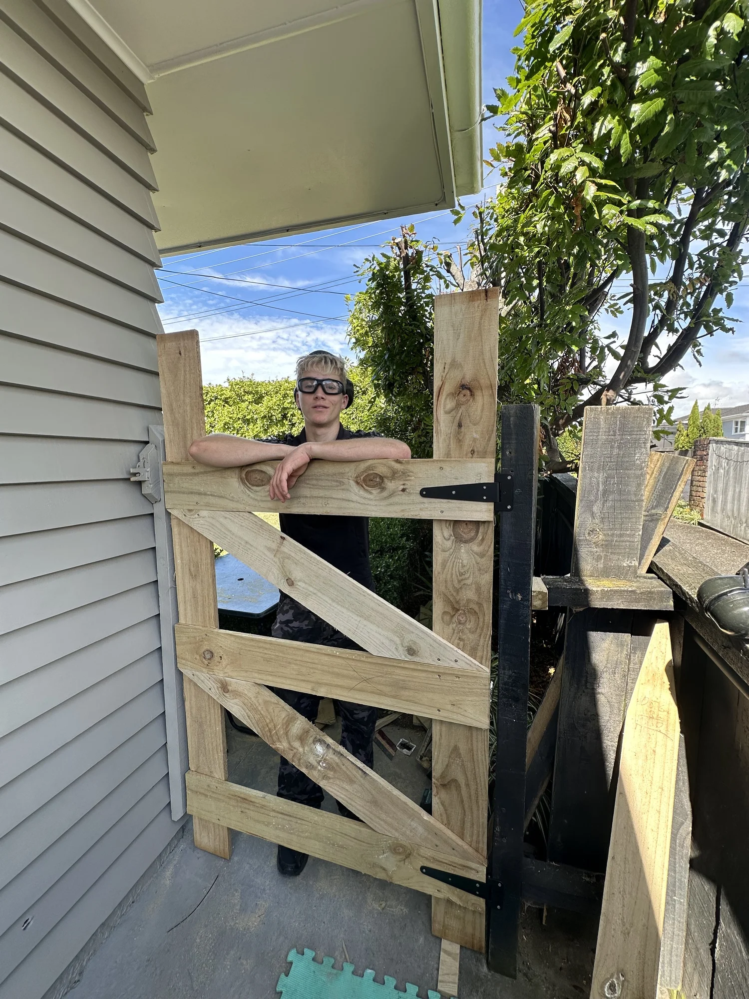 Hinges fitted to a custom timber garden gate during installation in Shelly Park