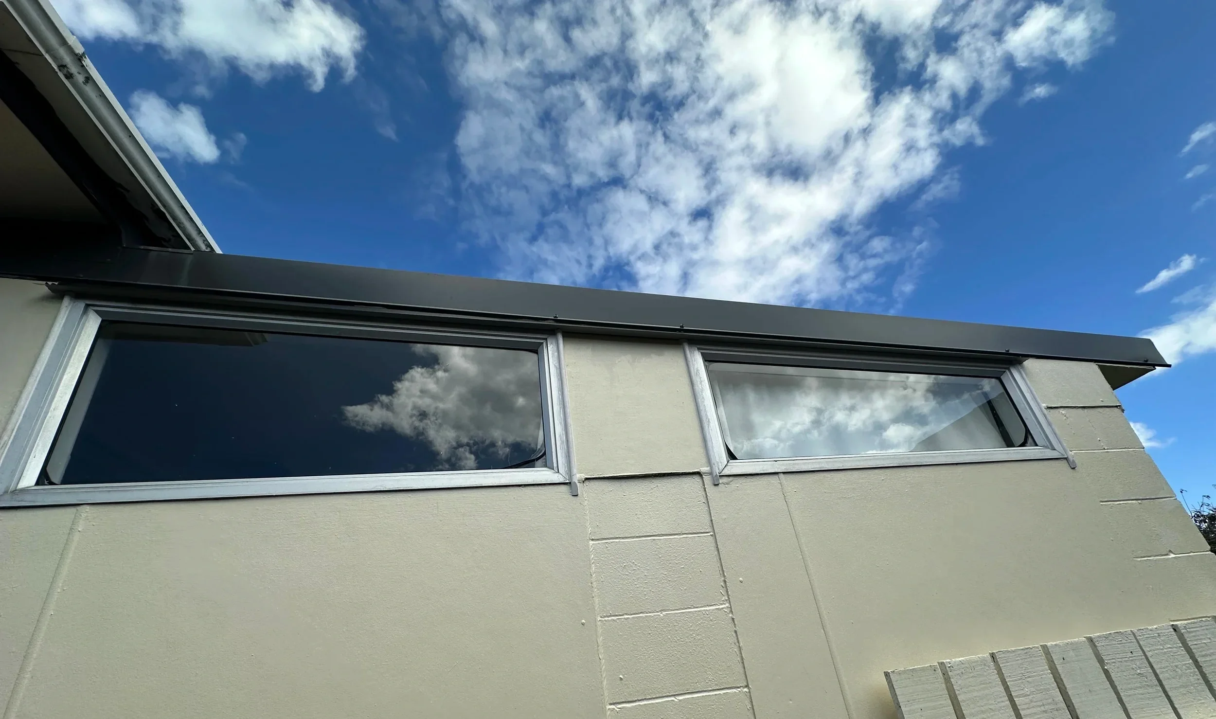 Close-up of completed window flashing, custom scribe and sealed junction in Botany