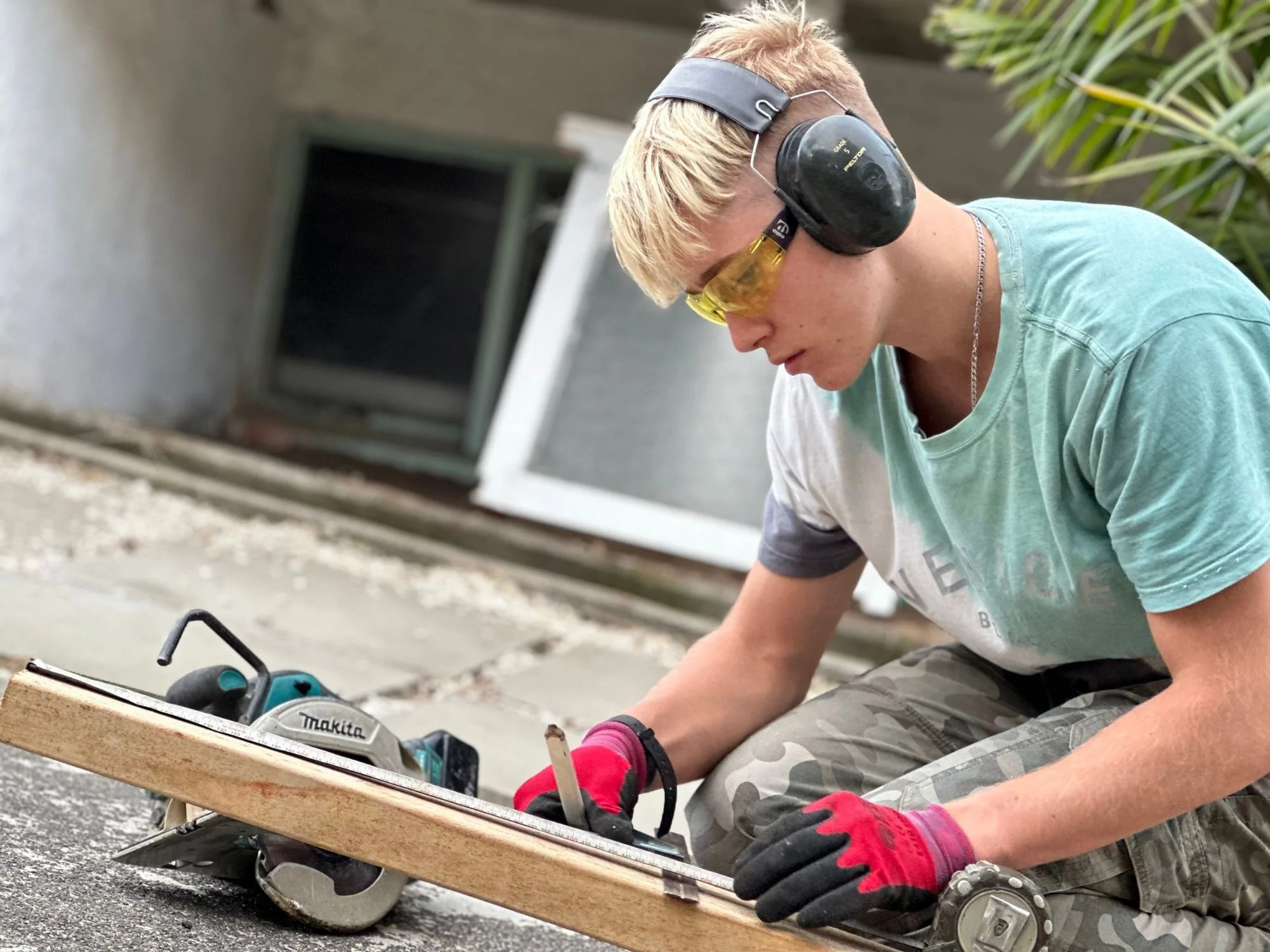 Cutting timber with a circular saw on a carpentry job in East Auckland — Handyman Botany
