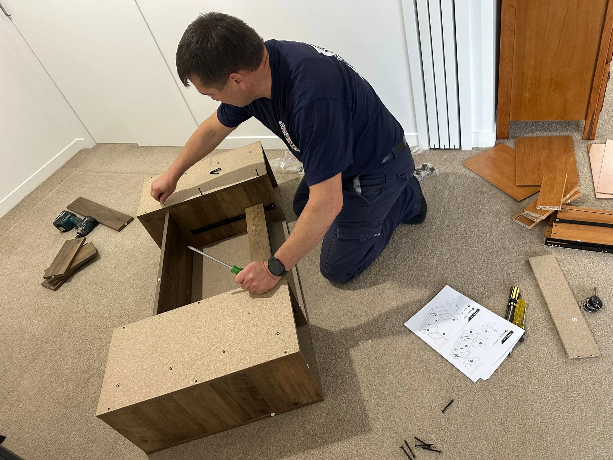 Flat-pack furniture assembly in East Auckland — Handyman Botany assembling a desk for a happy customer