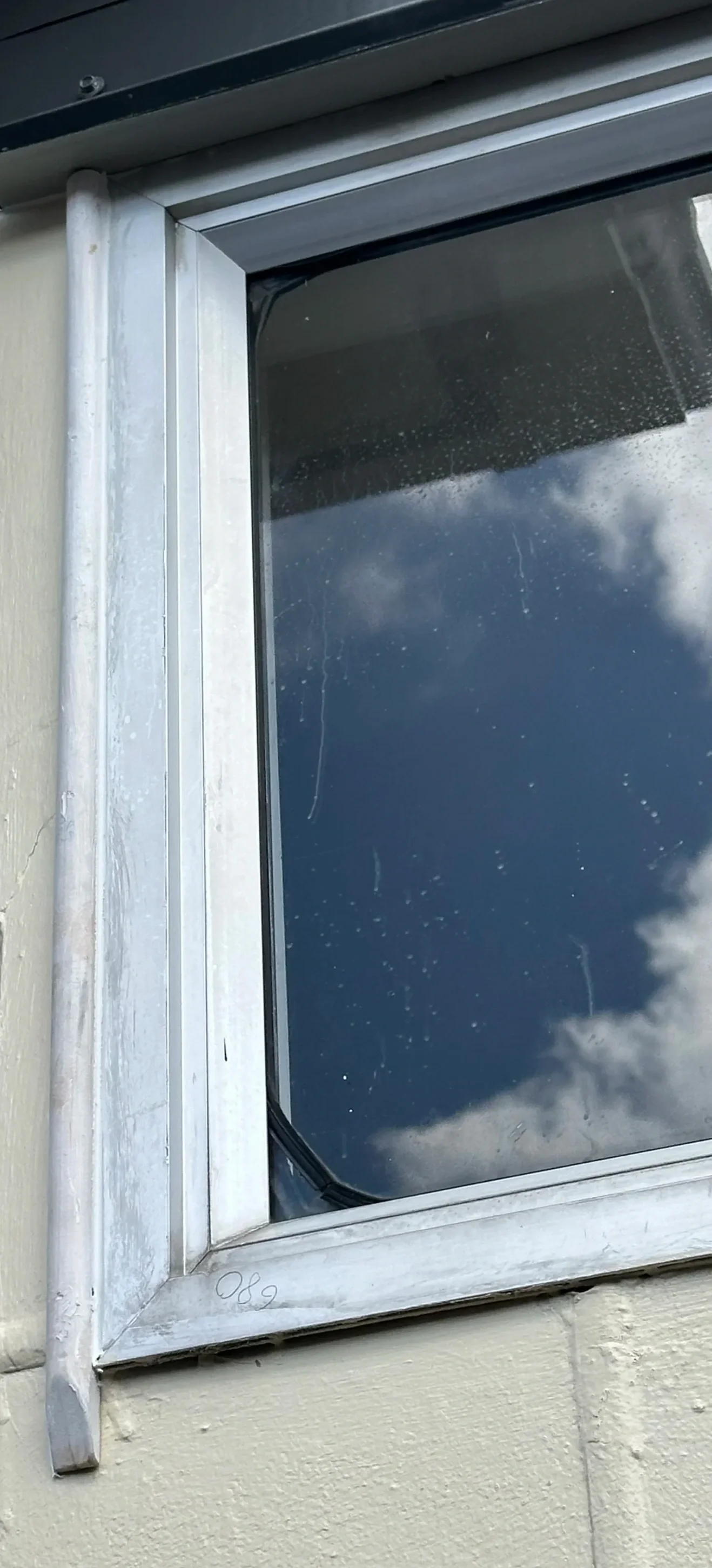 New custom scribe installed over window flashing during a Botany window repair project
