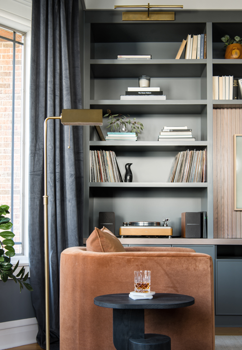 Custom built-in bookshelf with accent furniture