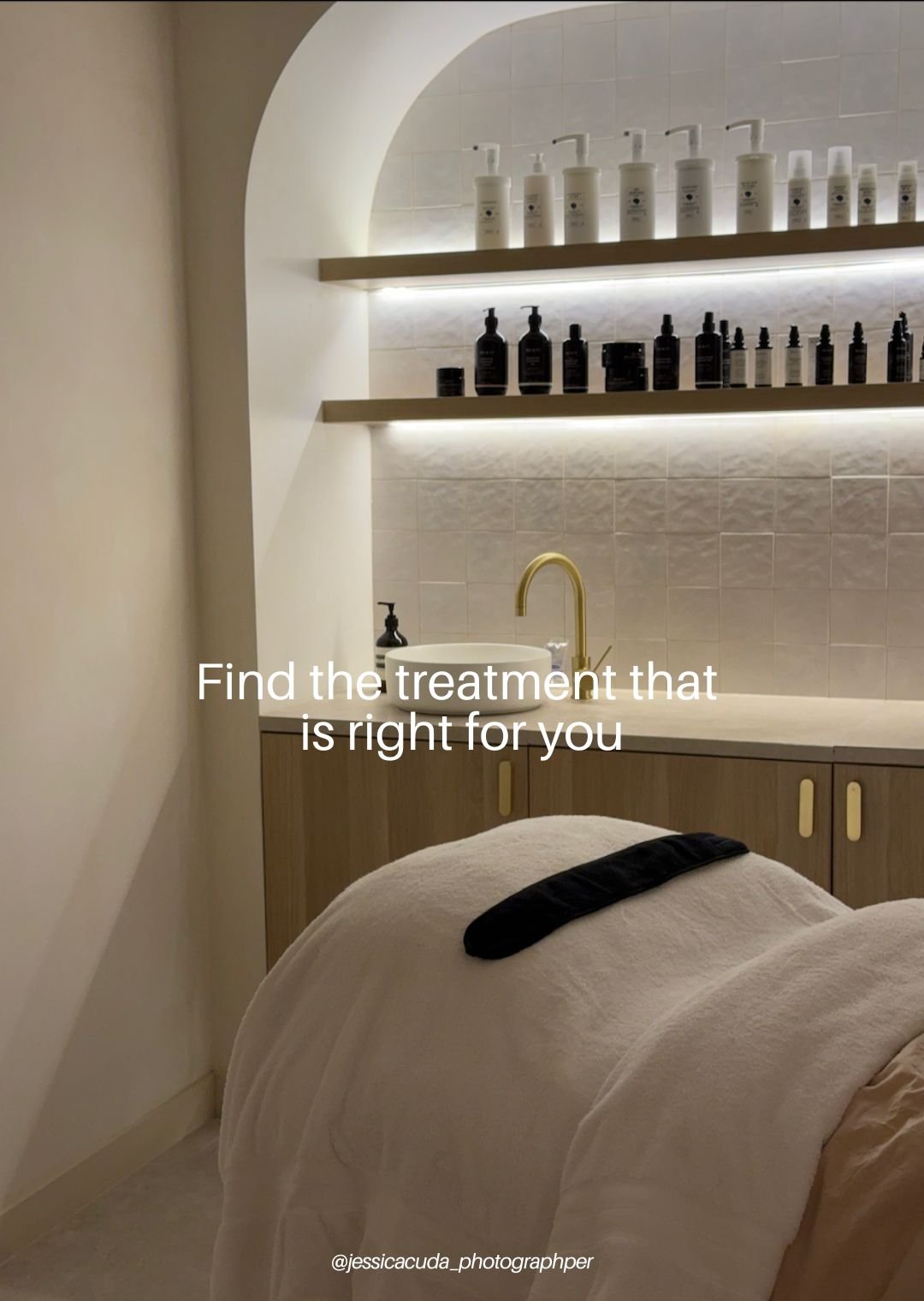 The facial room at AMIRI Studio in Newcastle with a shelf full of dermavidual and Mukti products and the bed with fresh white towels. Text overlaid stating "find the right treatment for you."