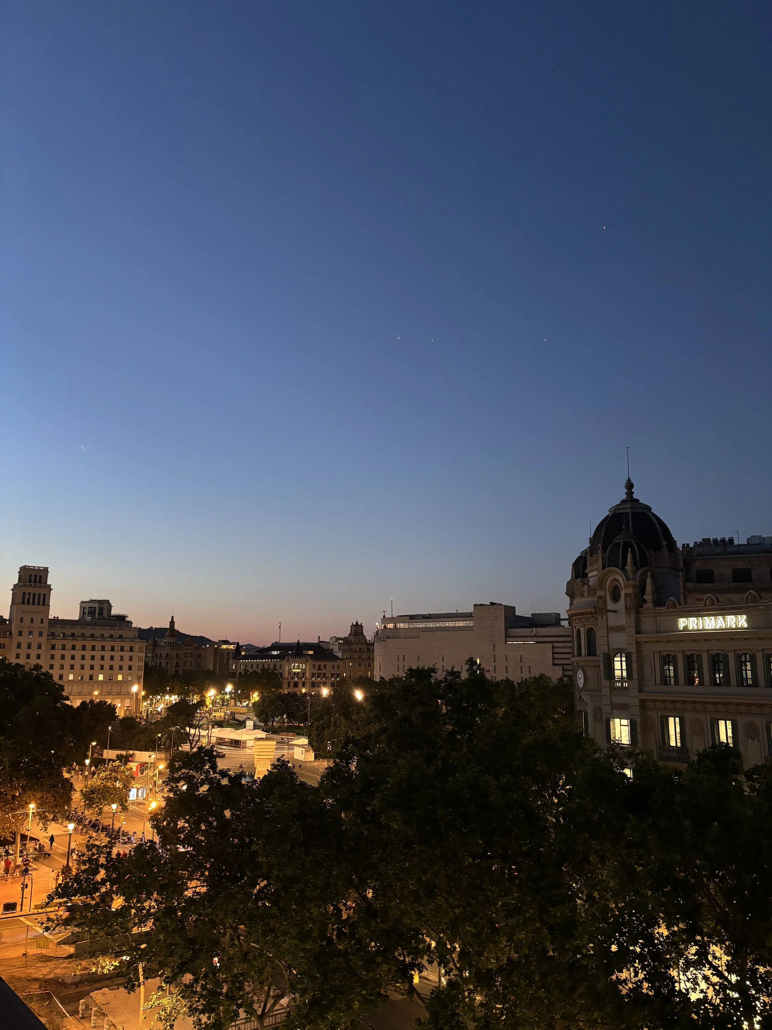 Barcelona at night on a rooftop.jpeg