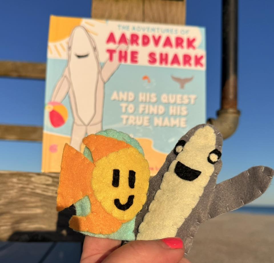 both puppets and book.jpg