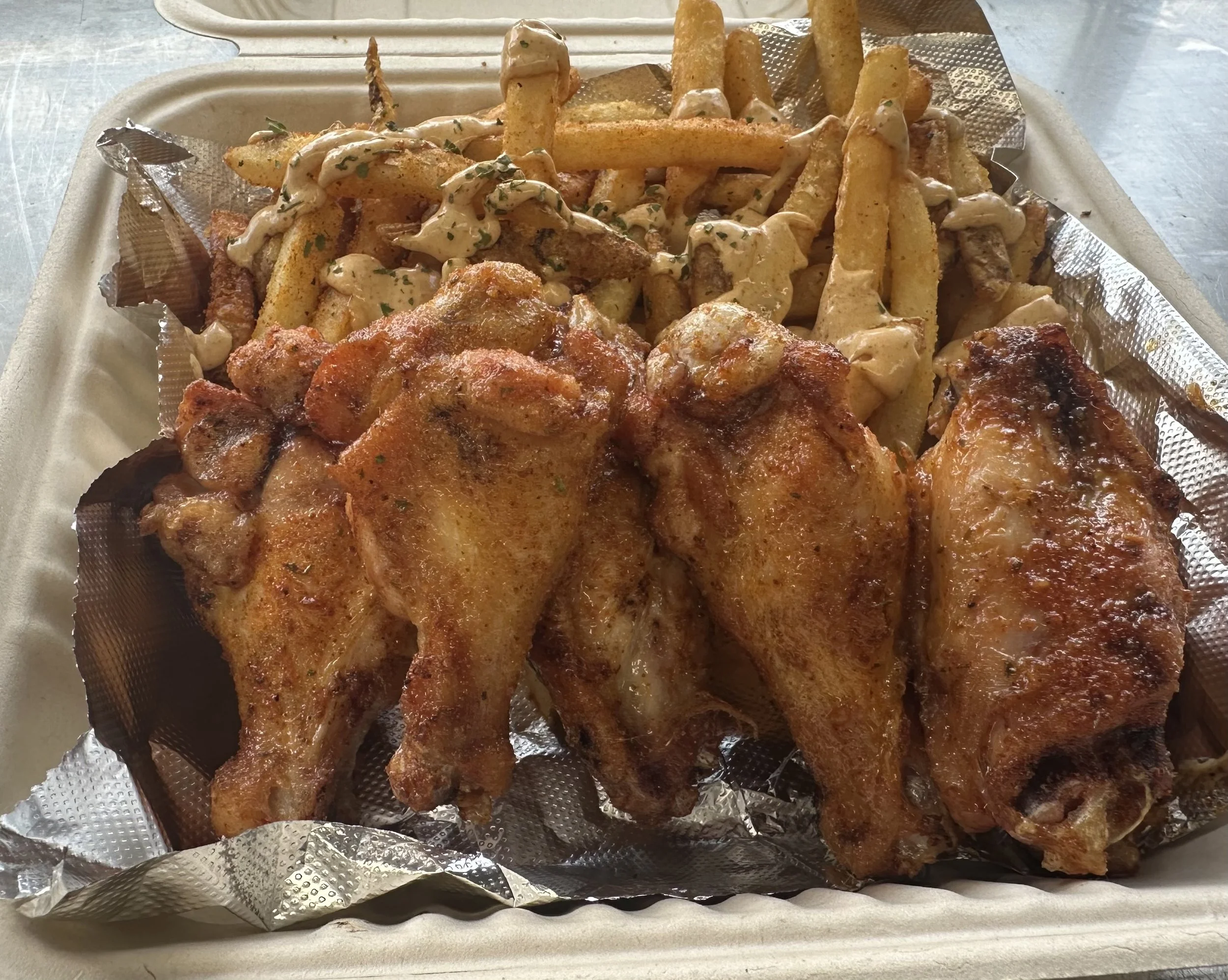 Cajun Smoked Wings & Cajun Dusted Fries with Scratch Remoulade Sauce.
