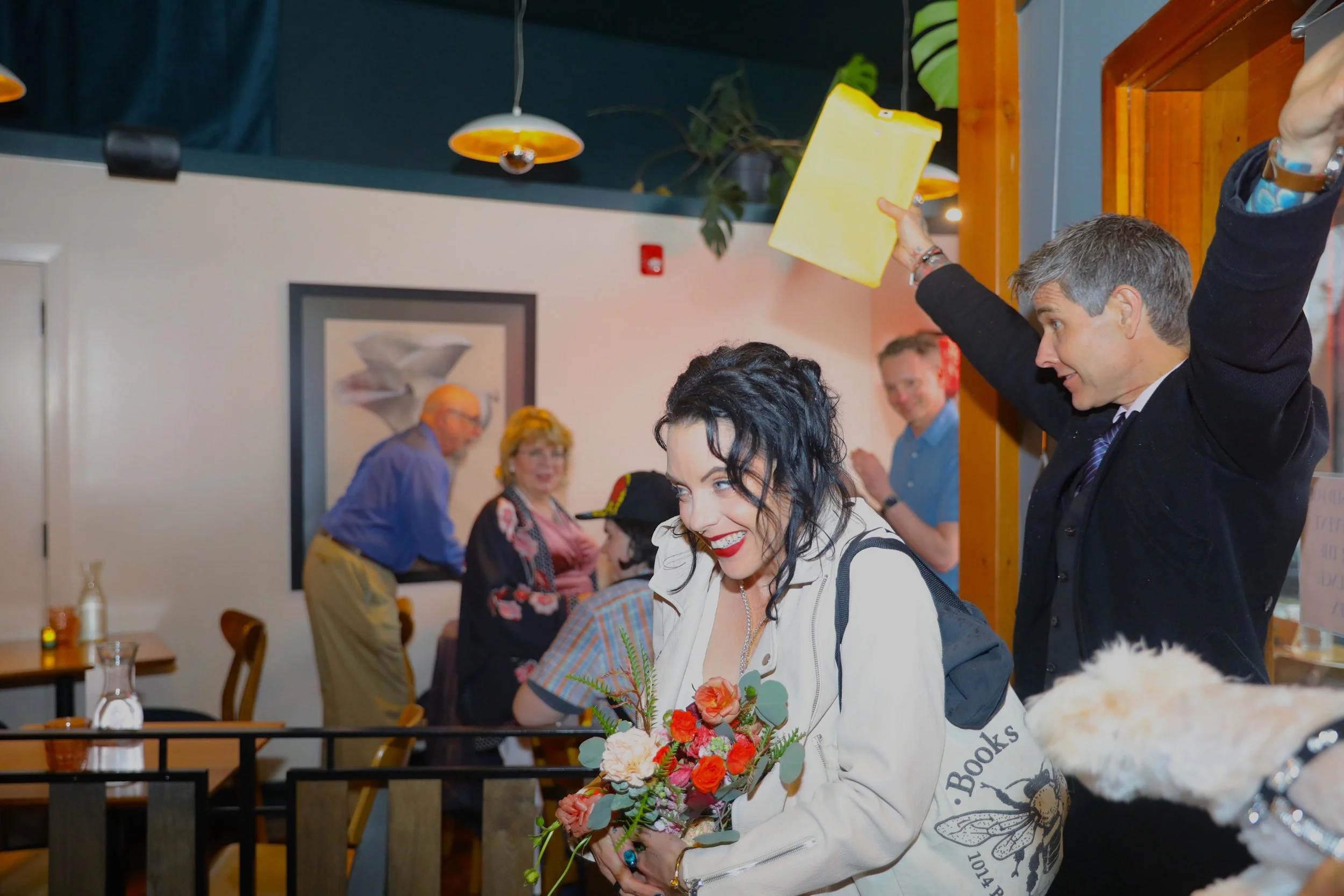 Hosts celebrating their wedding and entering into the venue