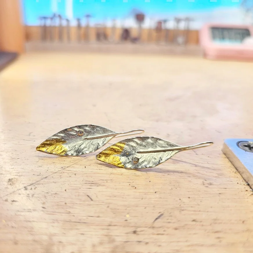 2025_OliveLeafEarring_Diamond_GoldTip_Square_Desk.jpg
