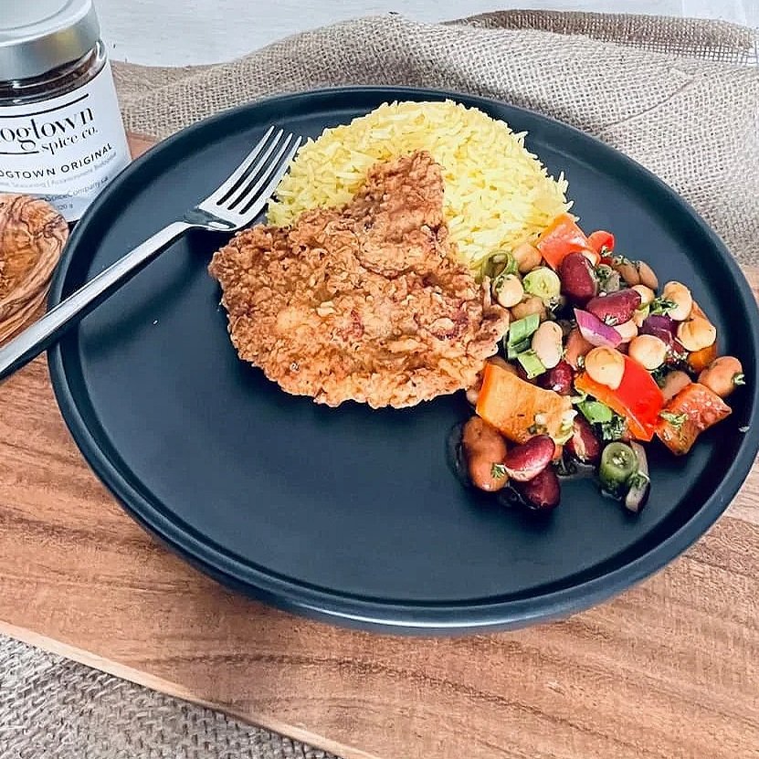 golden brown pork schnitzel with hogtown original organic spice blend infused breading