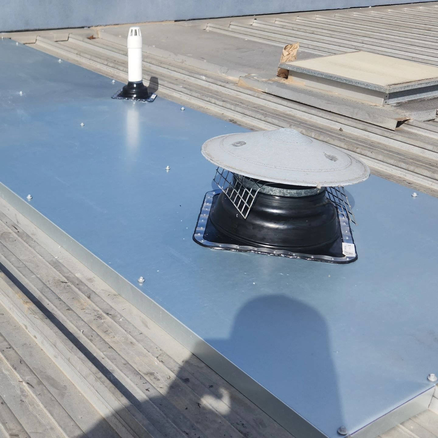 Leaking deck roof penetrations fixed with hopper flashings to prevent water pooling and ingress into building. Get your roof leaks fixed before winter hits!