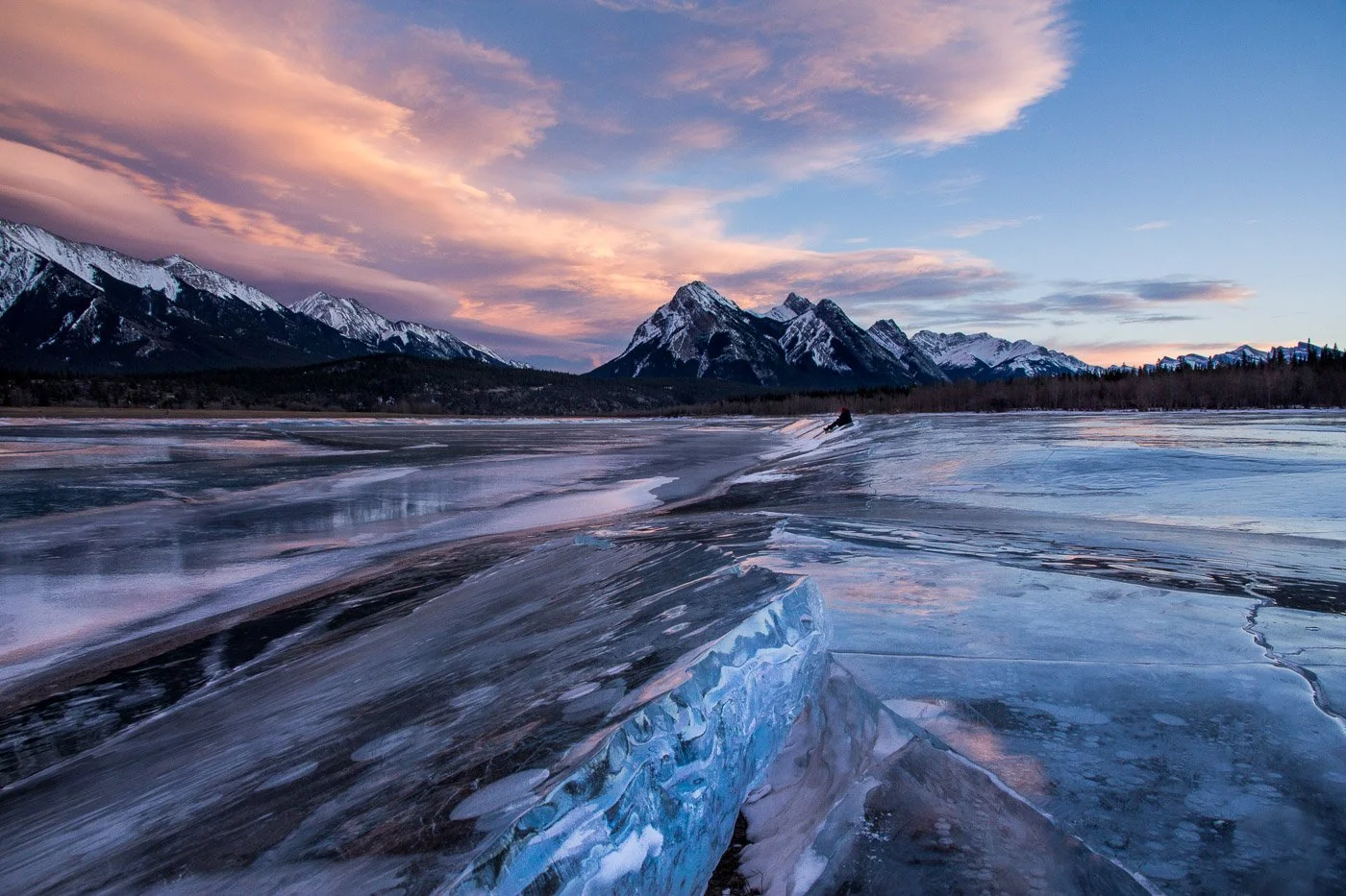 Ice heave leading to mountain and colourful sky frozen lake wild ice