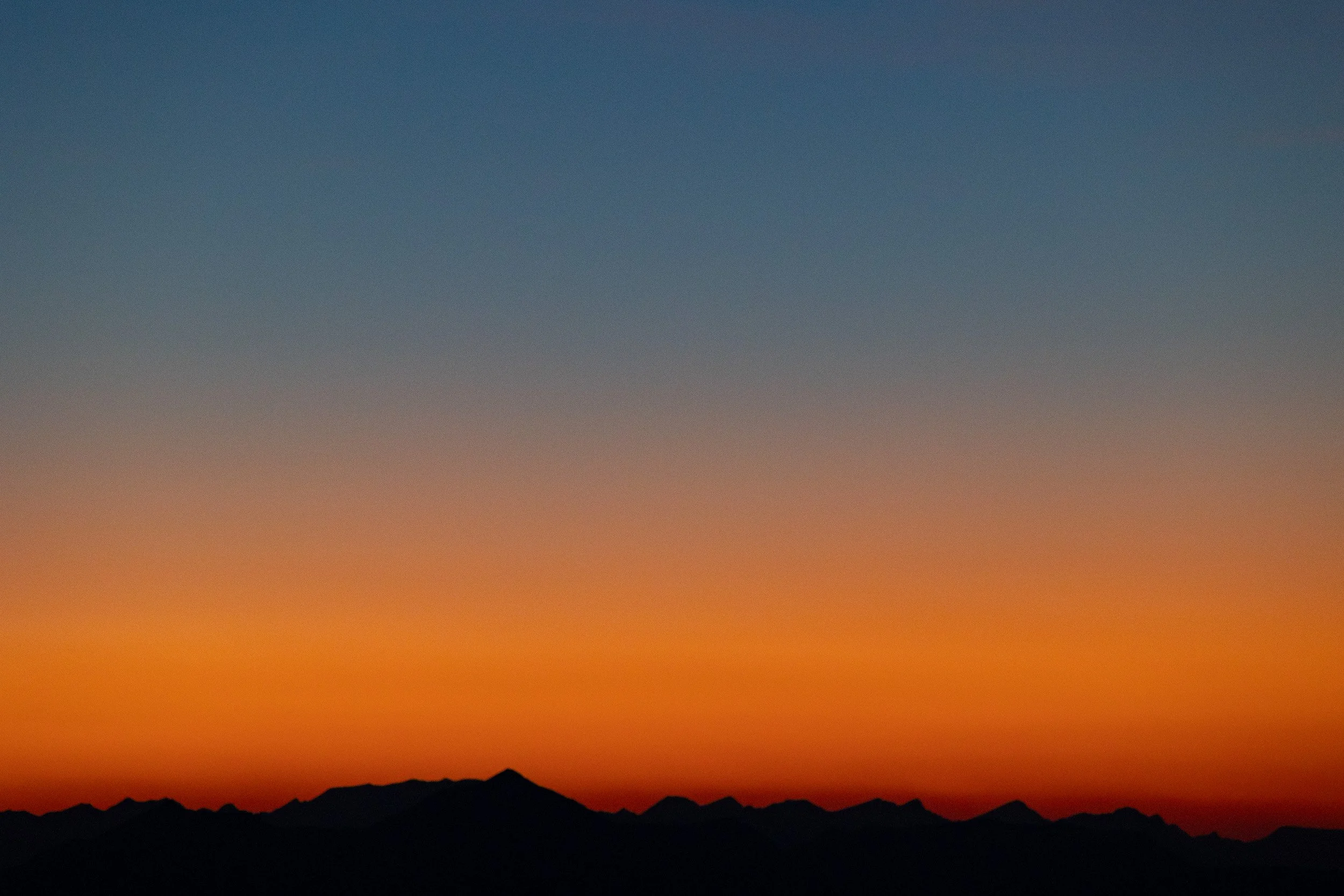 mountain silhouettes blue red sunset sky