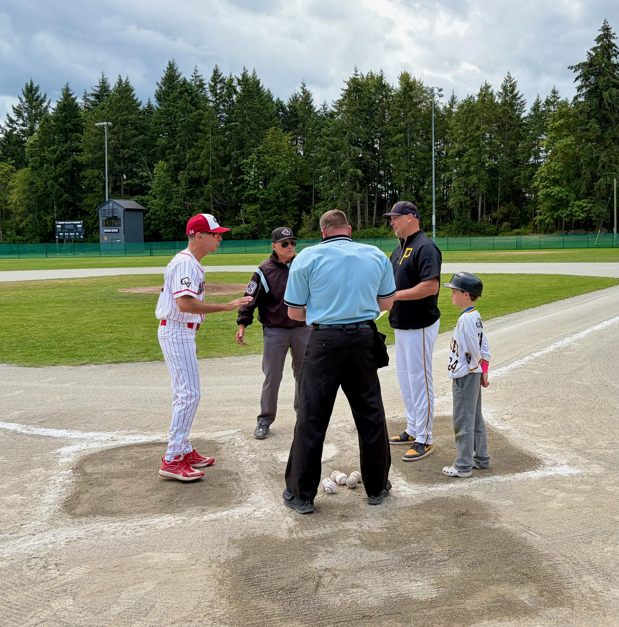 Jeff, Tristan, Cowichan Coach, Umpires - Pre-game Plate Meeting.jpeg