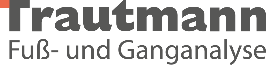 Der Schriftzug 'Trautmann Fuß- und Ganganalysen' in Grau auf schwarzem Hintergrund.
