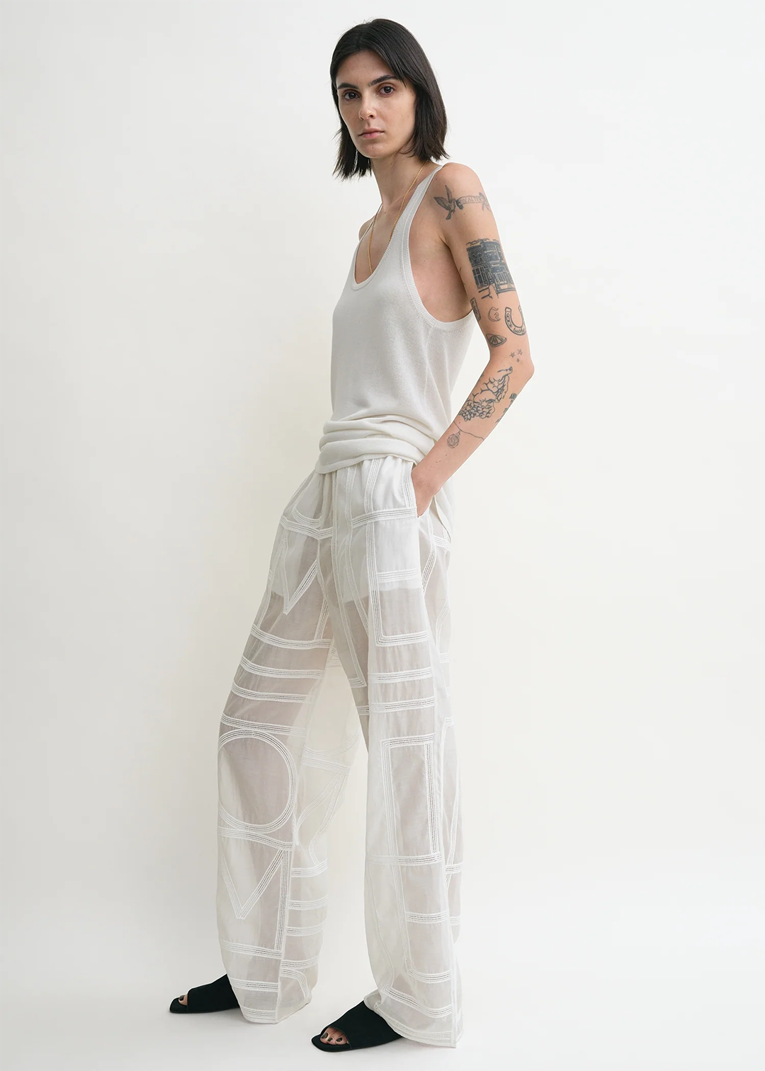 TOTEME_ECOM_PF25_SEASONAL_TROUSERS_253-WRB0316-FB0441_MONOGRAM_CROCHET_PJ_BOTTOMS_WHITE_B-1.png