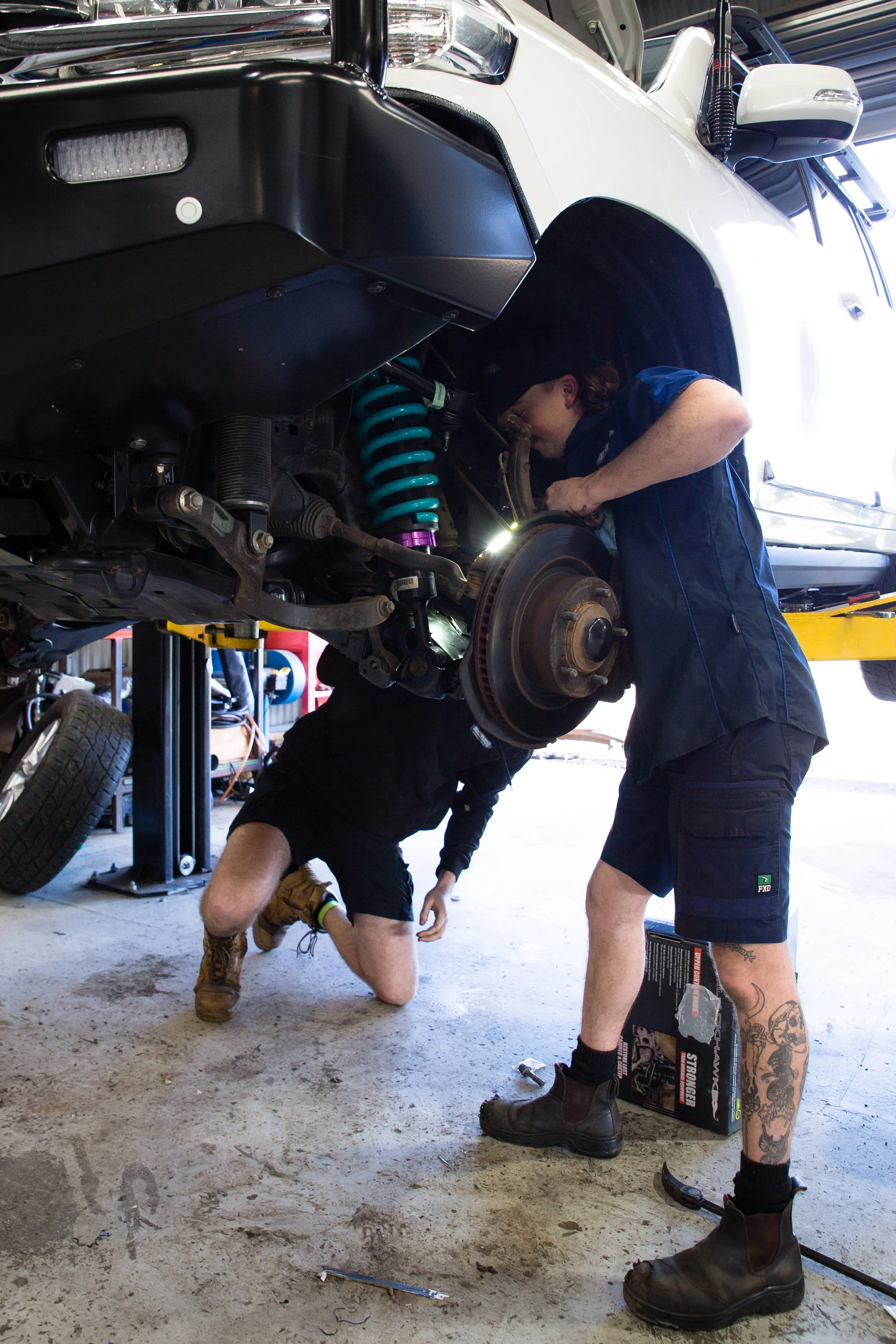 Technician running vehicle diagnostics