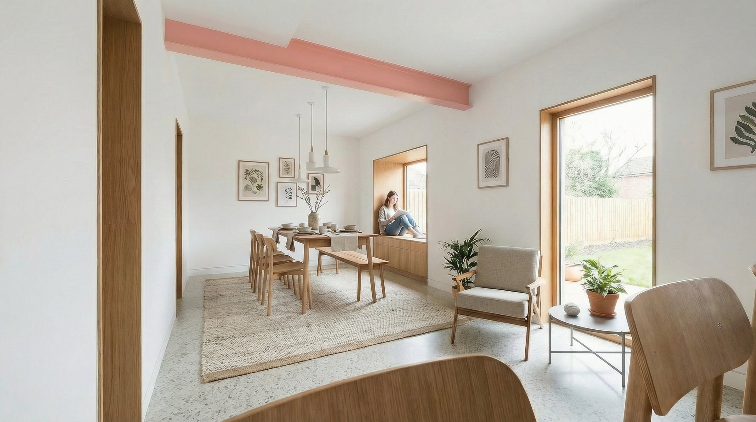 Open plan kitchen dining room with pink painted beam, terrazzo floor, oak furniture and bifold doors to garden.