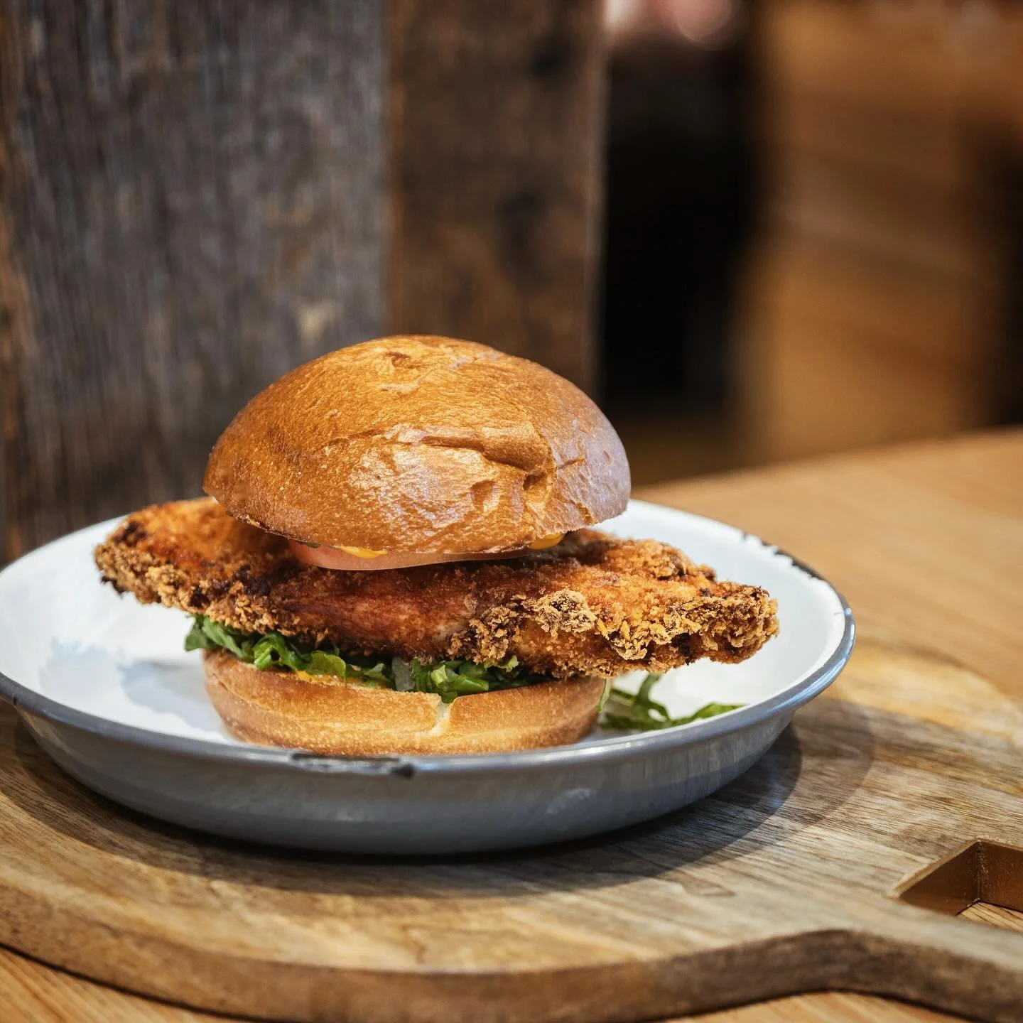 Wednesday blues? Yeah, we don&rsquo;t know her. 🍗😎

Meet your midweek MVP: crispy Red Bird chicken getting cozy between a buttery brioche bun with all the good stuff &mdash; crunchy romaine, juicy tomatoes, tangy pickles, and that spicy mayo that&r