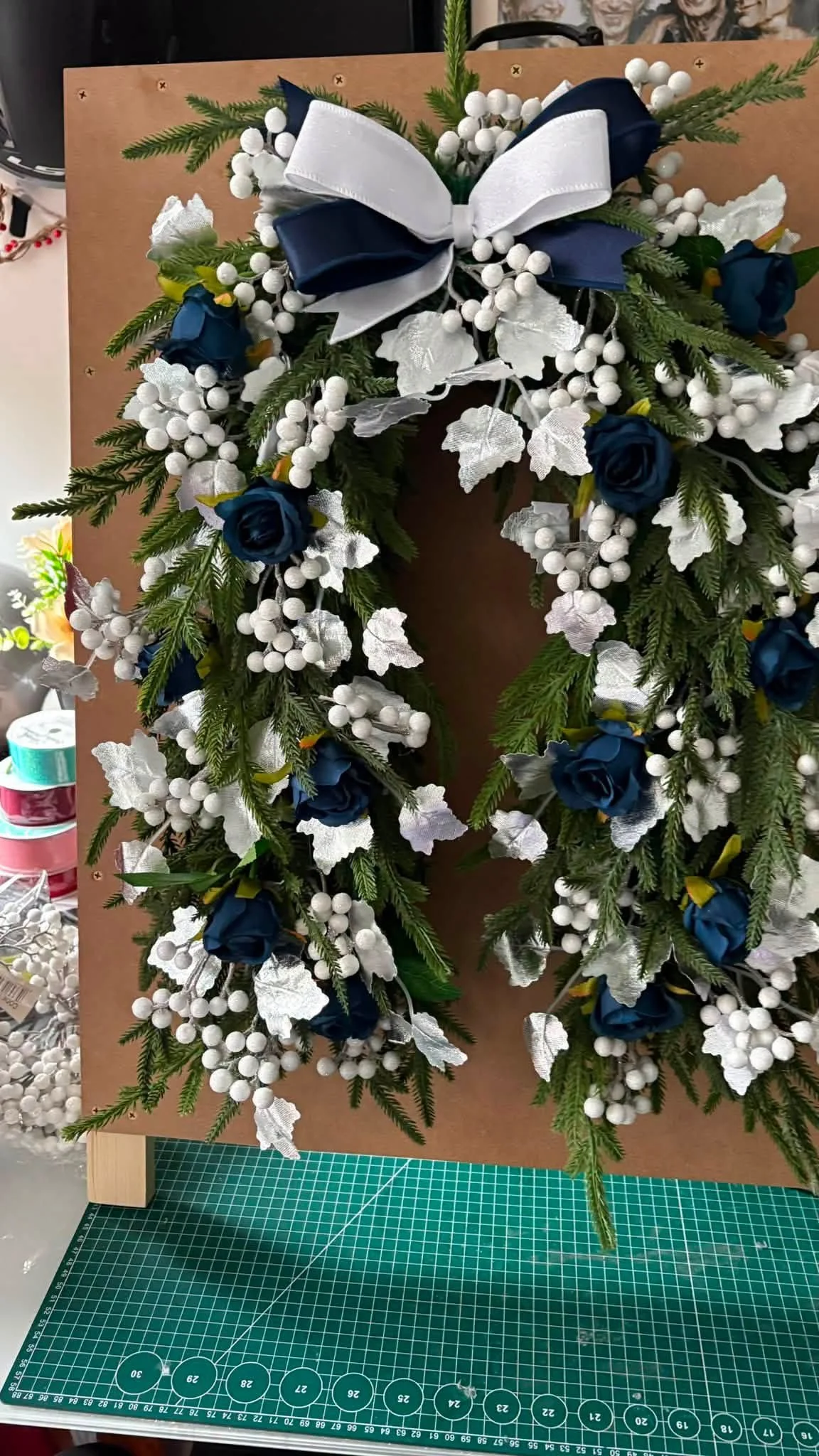navy roses and white berry horseshoe wreath