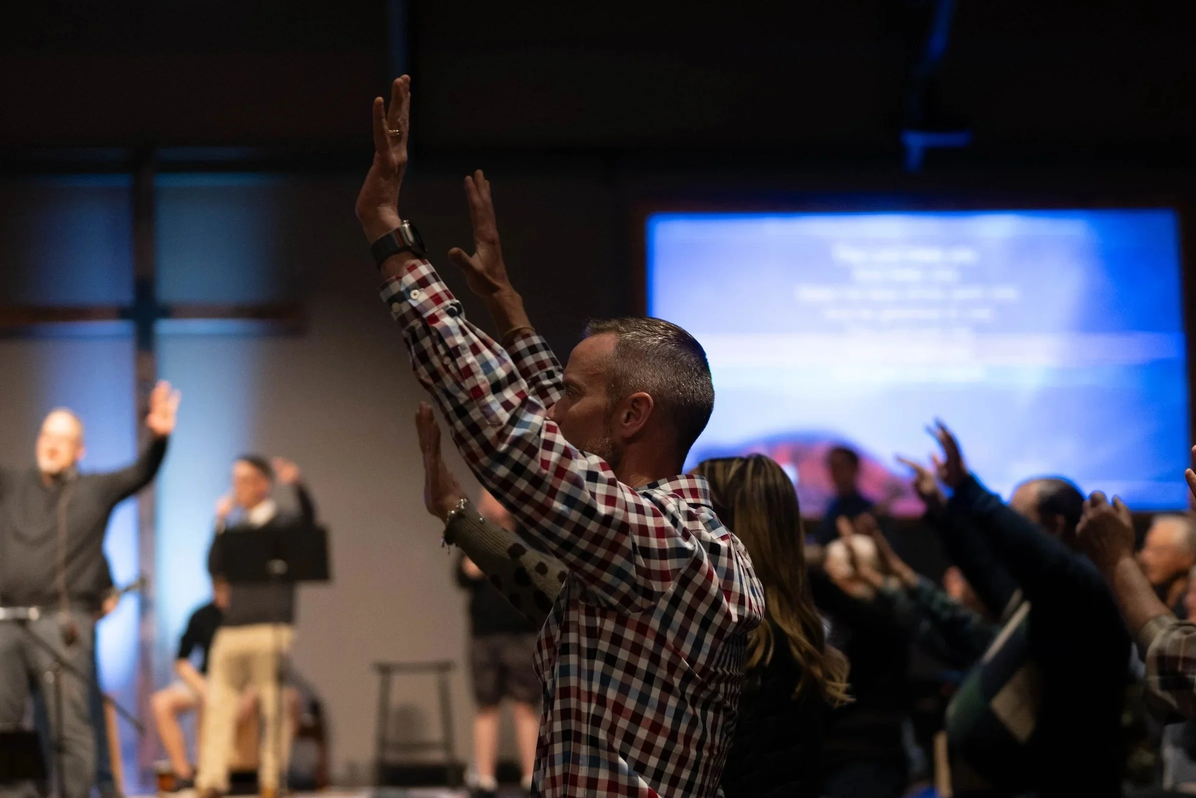Hand raised up during worship music.