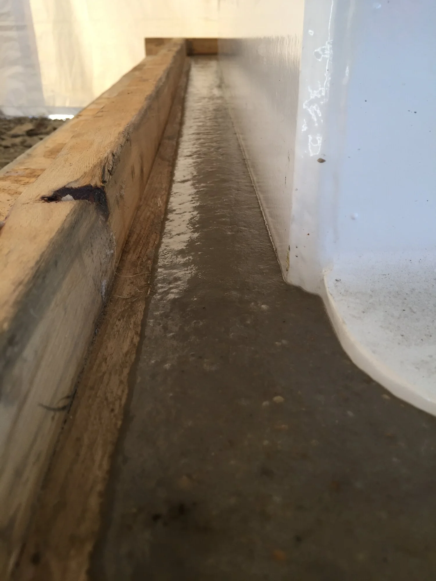 Escoweld 7505E epoxy grout flowing into industrial equipment foundation formwork
