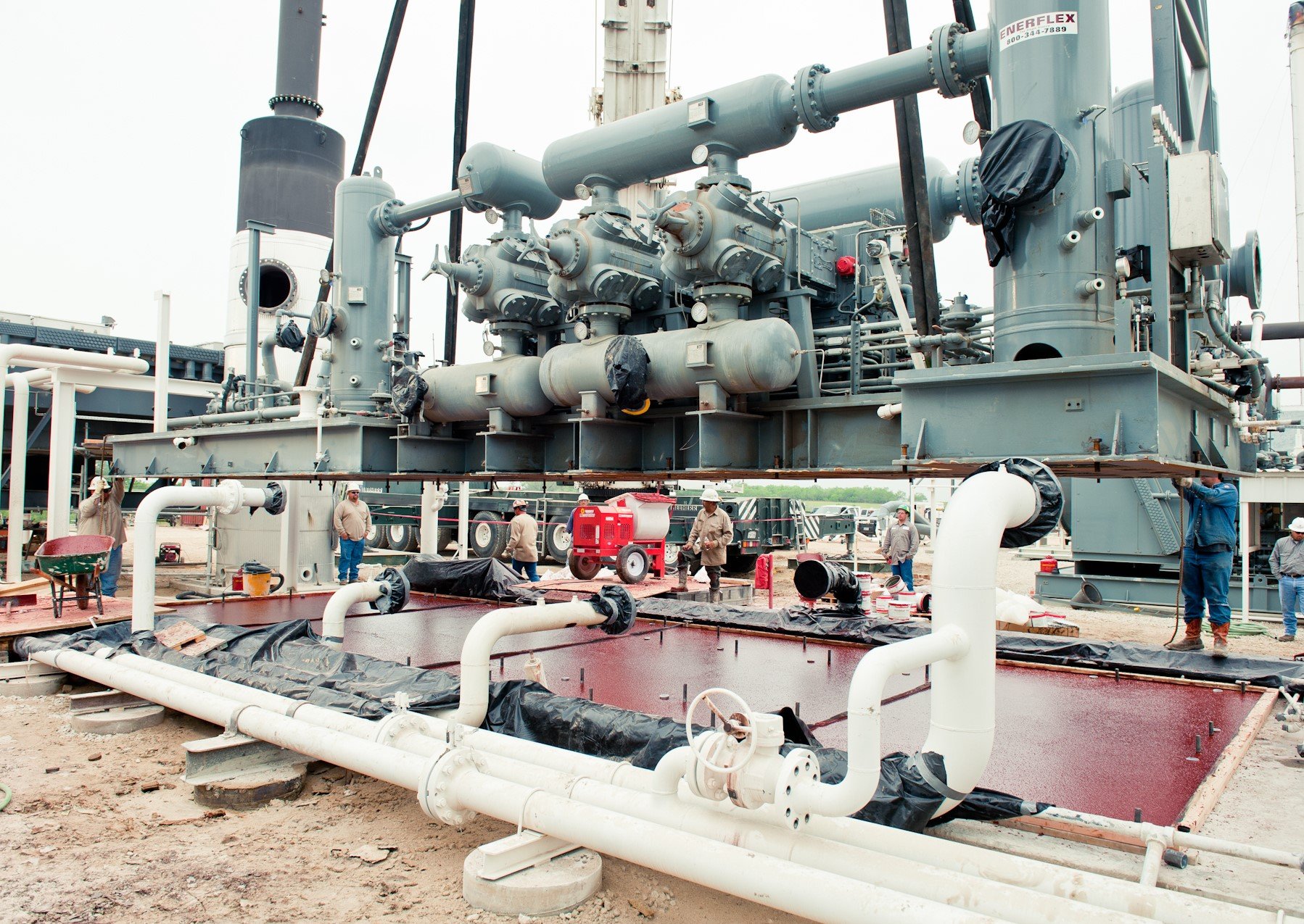 Chockfast Red epoxy grout poured on industrial machinery base plate