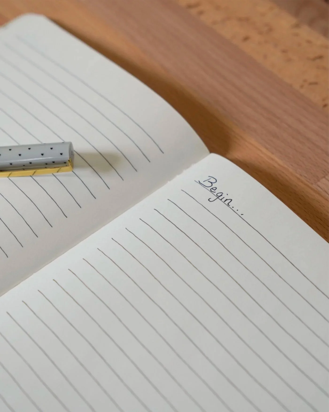 Open journal with the word “Begin,” symbolizing starting new habits and goals for the New Year. Sustainable habit-building, resolutions that last. Encore Concierge Medicine Chicago.