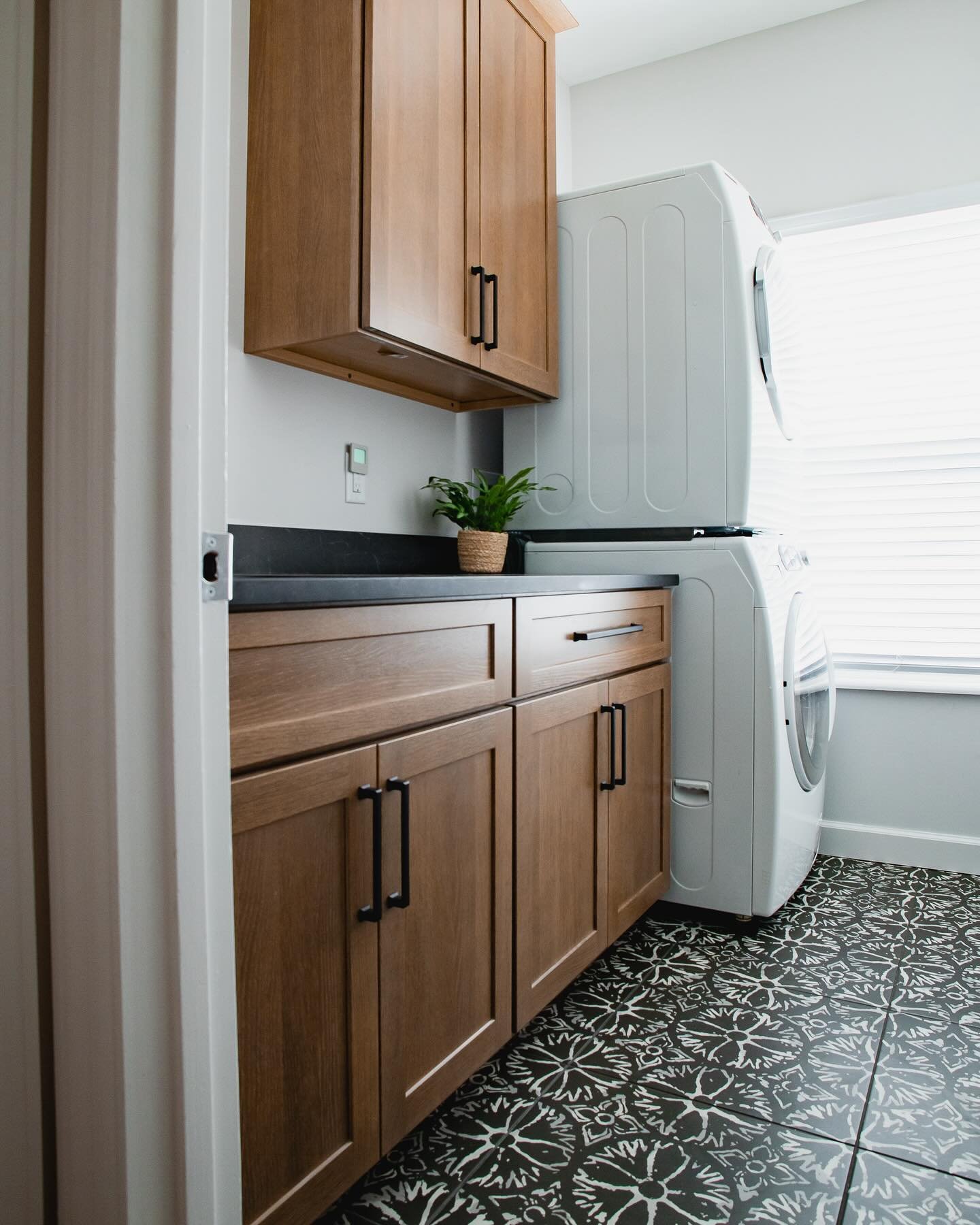 Small spaces are always a great time to try patterned tile! Our clients say it makes them smile every time they do laundry!