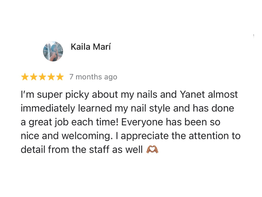 A positive customer review with a five-star rating. The text praises Yanet for understanding and executing the customer's nail style and compliments the welcoming staff and attention to detail. The review was posted seven months ago by a user named Kaila Marí.
