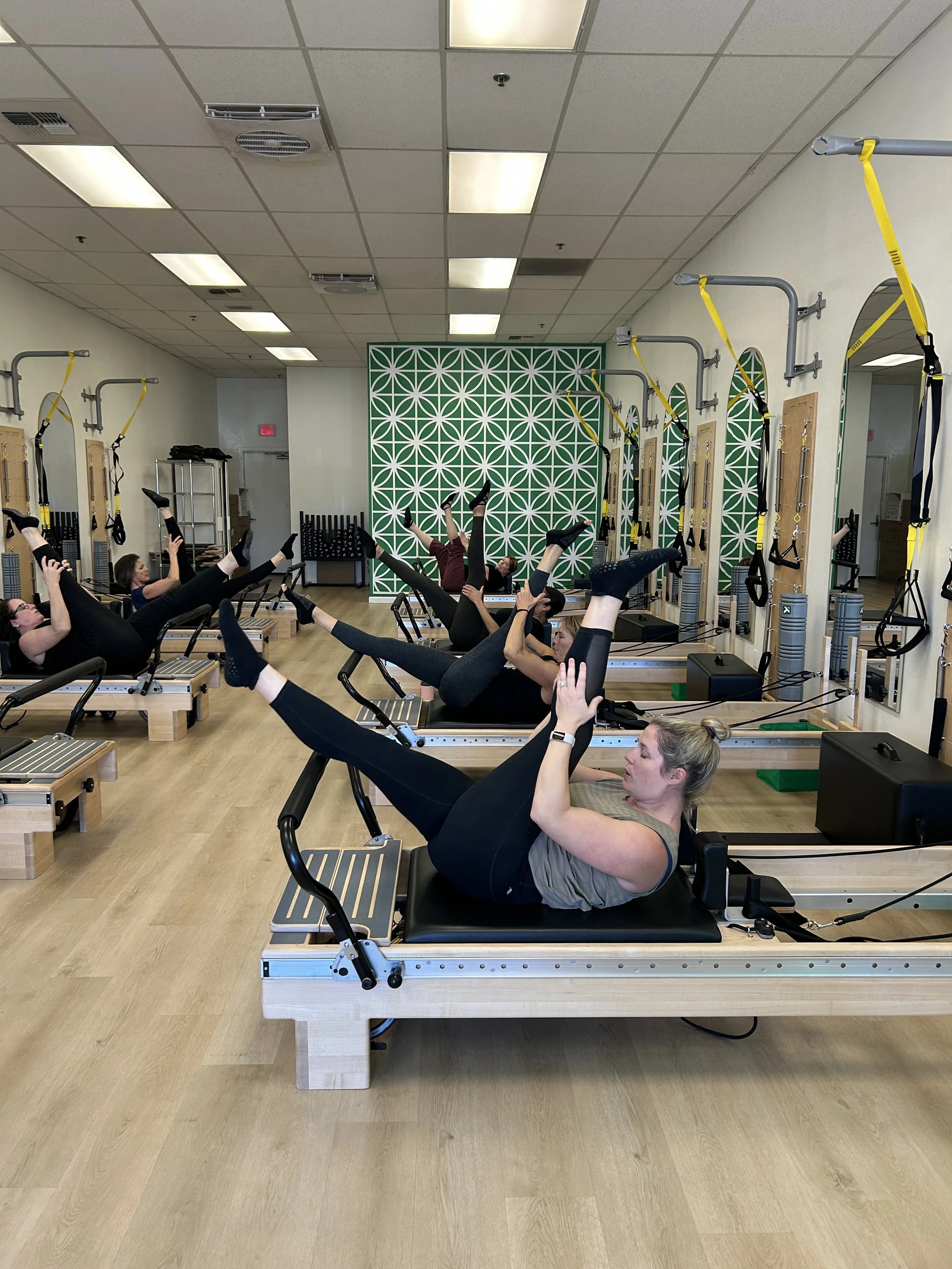 Group Pilates class on reformer machines Strength and mobility classes Escondido Poway