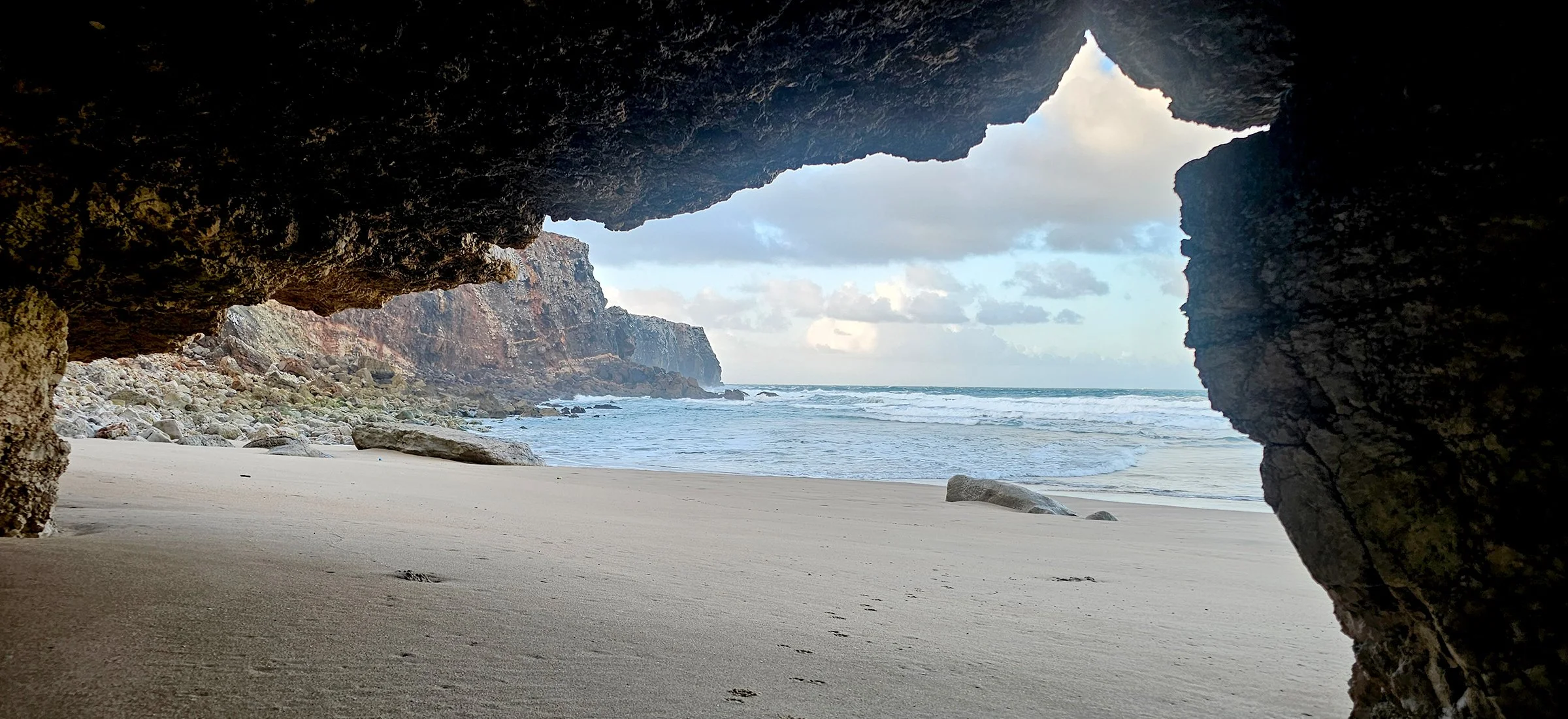looking at the sea through the rocks