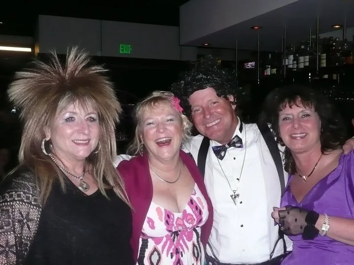 Joyful group of women singing karaoke at a DJ Party event in Bend, Oregon, showcasing the lively atmosphere and community spirit of karaoke nights in the area