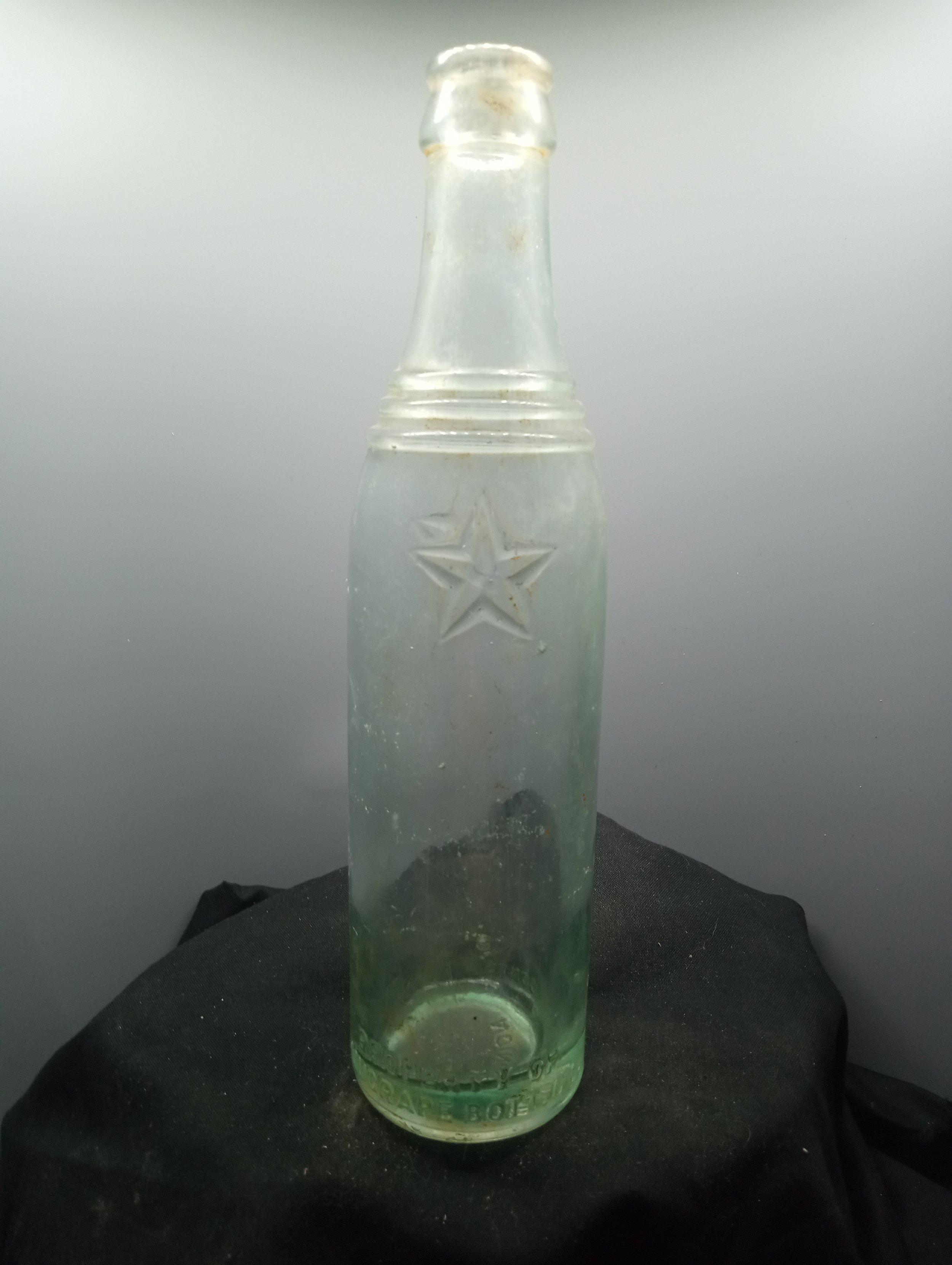 AGE - 1925-1927 - TYPE - MACHINE - FRONT - * (base) PROPERTY OF / NUGRAPE BOTT. CO - BACK - * (base) L. G. W. / CONTS. 8 1/2 FL. OZ. - BOTTOM - UNION / S.C. - COLOR - AQUA \ RARITY - RARE+