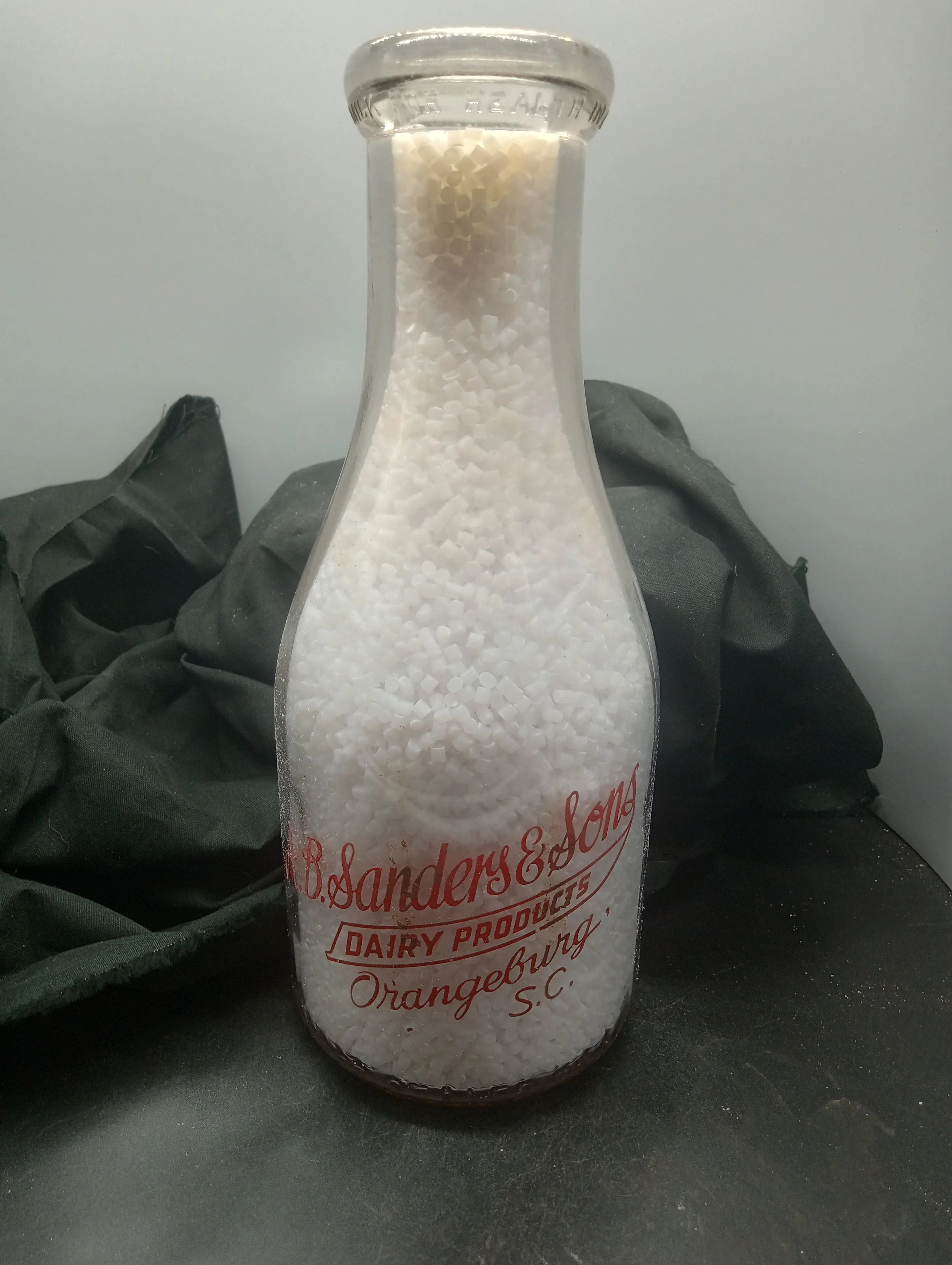 (top) MILK FOR HEALTH IN A BOTTLE FOR SAFTY (body) AB. SANDERS & SONS / DAIRY PRODUCTS / ORANGEBURG ' / S..C. (embossed at bae) REGISTERED SEALED - BACK - BABY / KNOWS BEST ! / MILK / IS GOOD / FOR / GROWN - UPS / TOO (embossed at base) ONE QUART LI