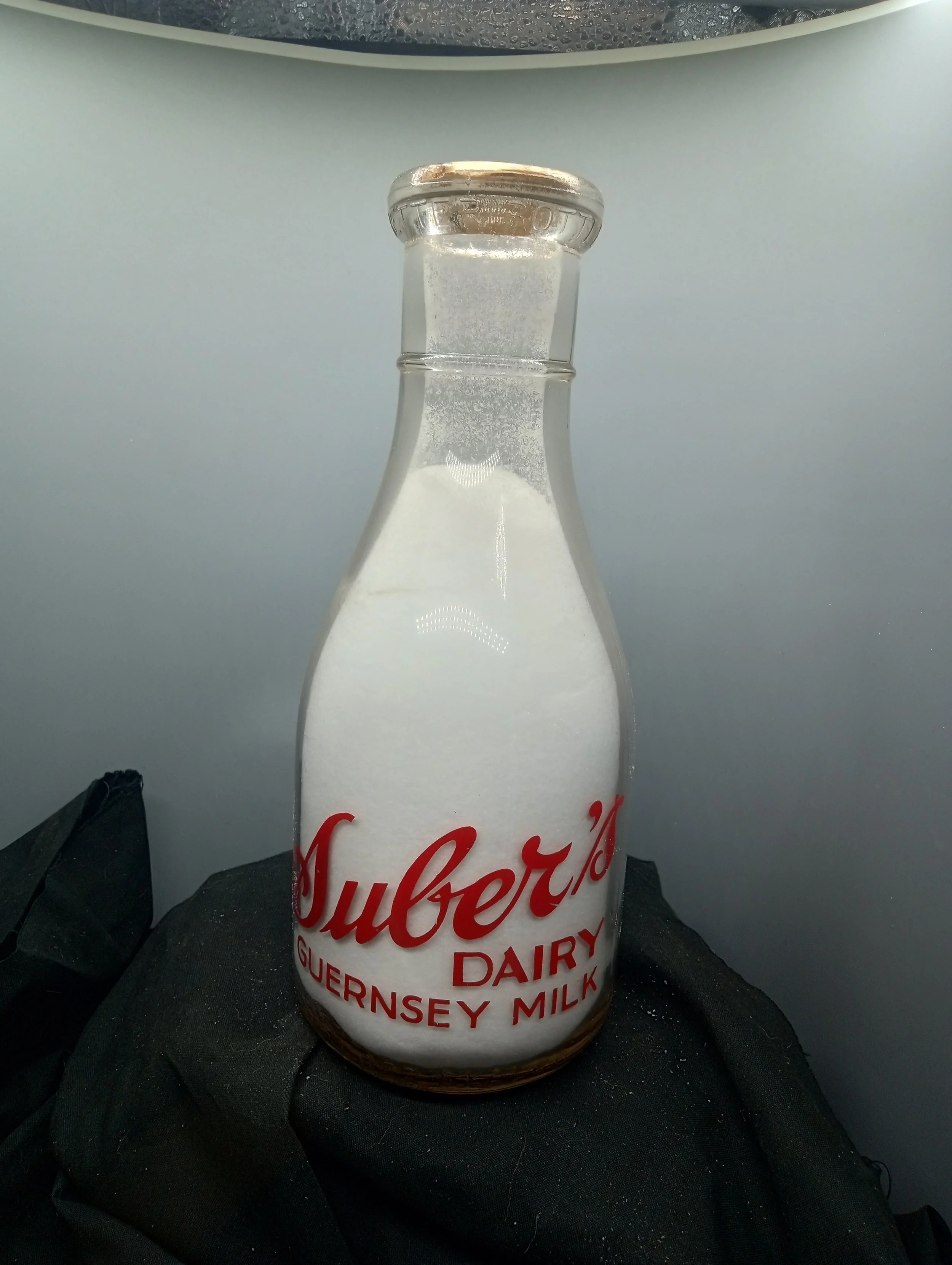 TOP - A BOTTLE OF MILK IS A BOTTLE OF HEALTH - FRONT - SUBER'S / DAIRY / GUERSEY MILK / REGISTEED SEALED - BACK - GUERNSEY / MILK / ONE QUART LIQUID