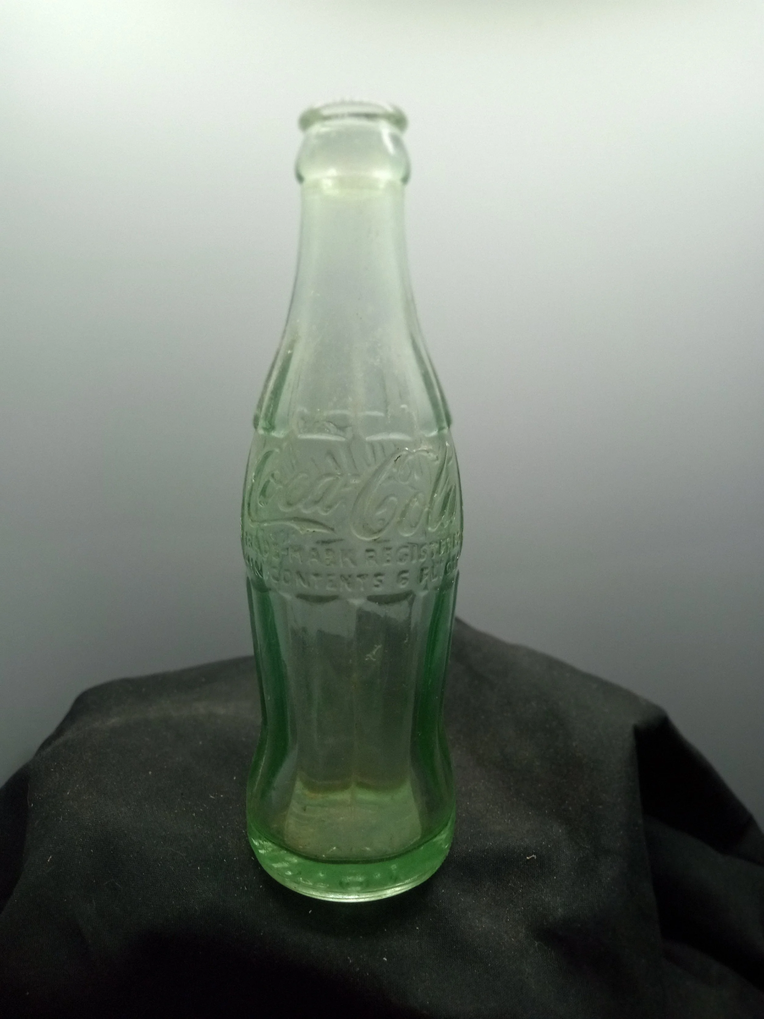 AGE - 1951-1958 - TYPE - MACHINE - FRONT - COCA-COLA / TRADE-MARK REGISTERED / MIN. CONTENTS 6 FL. OZS. - BACK - COCA-COLA / TRADE-MARK REGISTERED / IN U.S. PATENT OFFICE (near base) 53-60 - BOTTOM - HAMPTON / L / S.C. - COLOR - AQUA \ RARITY - COMMO