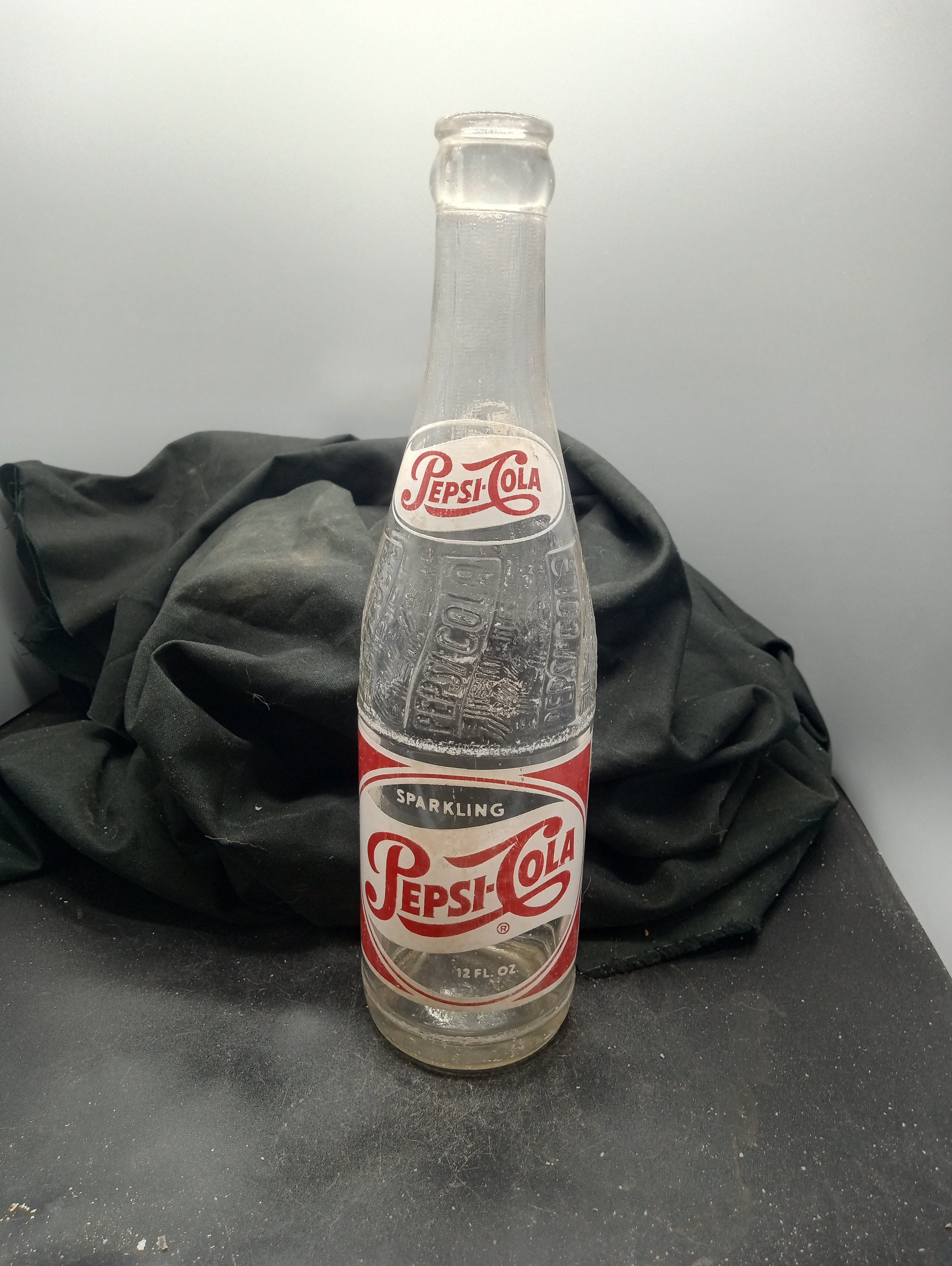 AGE - 1956 - TYPE - MACHINE - FRONT - (shoulder) PEPSI-COLA (body) SPARKLING / PEPSI-COLA (R) / 12 FL. OZ. - BACK - (shoulder) PEPSI / 635 (body) FRANCHISED BOTTLER: / PEPSI-COLA BOTTLING CO. / ANDERSON, S.C. - BOTTOM - 15-B-56 / 1587-15 - COLOR - CL