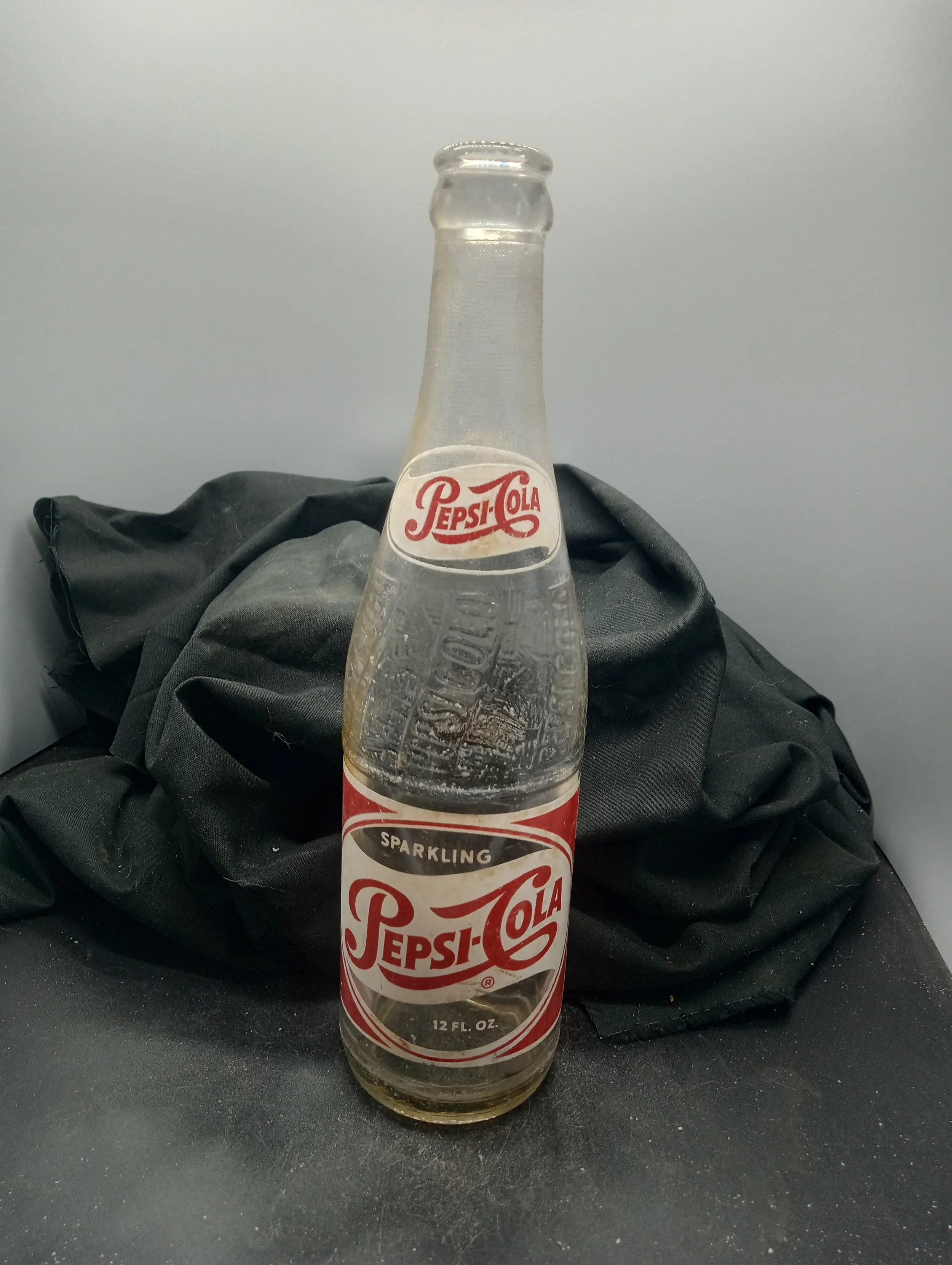 AGE - 1955 - TYPE -  MACHINE - FRONT - (shoulder) PEPSI-COLA (body) SPARKLING / PEPSI-COLA / (R) / 12 FL. OZ. - BACK - PEPSI / 535 (body) FRANCHISED BOTTLER: / PEPSI-COLA BOTTLING CO. / ANDERSON, S.C. - BOTTOM - L G W  7  B55  15 - COLOR - CLEAR \ RA