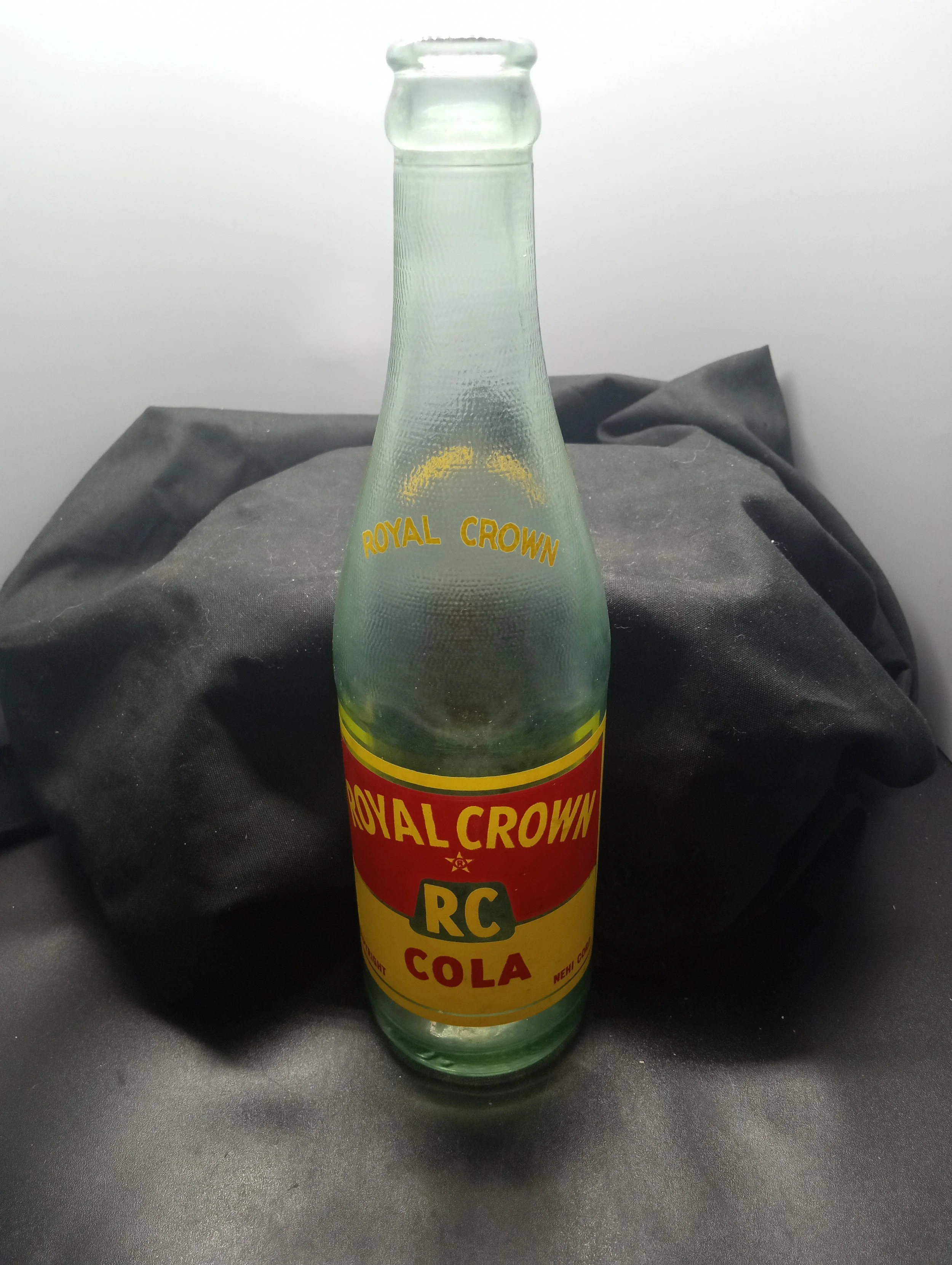 AGE - 1954 - TYPE - MACHINE - FRONT - (shoulder) ROYAL CROWN (body) ROYAL CROWN / (R) / RC / COLA / COPYRIGHT NEHI CORP. - BACK - PROPERTY OF / ROYAL CROWN BOTTLING CO. / ROCK HILL, S.C. - BOTTOM - 648 5 L G W 4 8 - COLOR - AQUA \ RARITY - COMMON