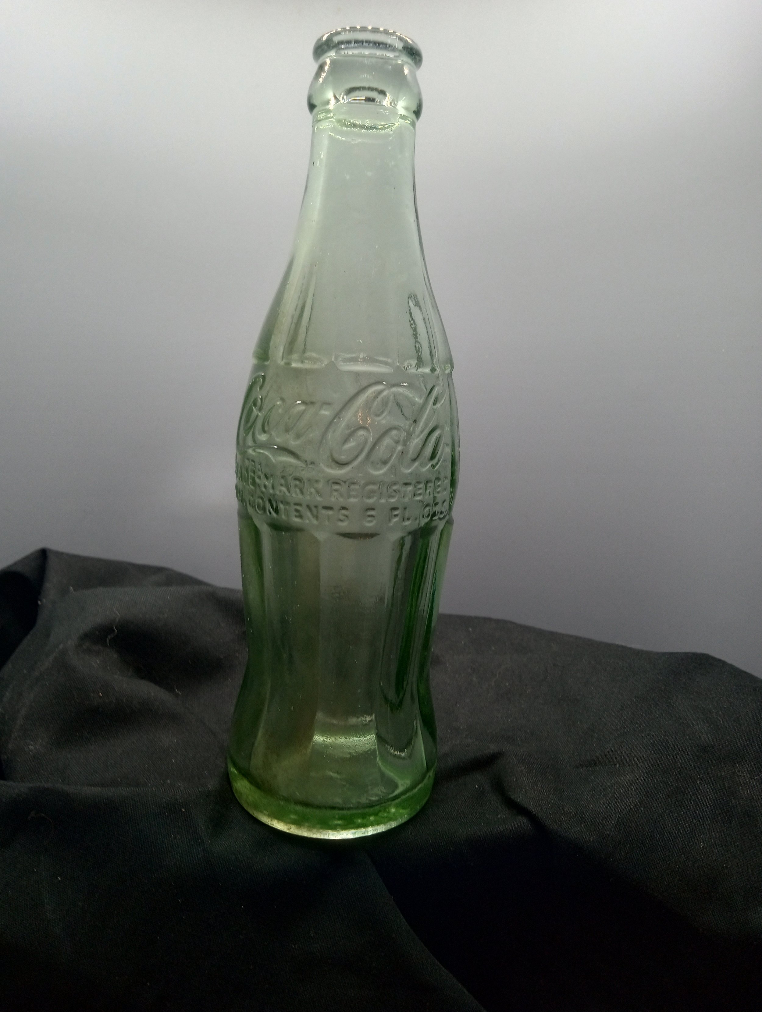 AGE - 1951--1958 - TYPE - MACHINE - FRONT - COCA-COLA / TRADE-MARK REGISTERED / MIN. CONTENTS 6 FL. OZS. - BACK - COCA-COLA / TRADEMARK REGISTERED / IN U.S. PATENT OFFICE (near base) 59-52 - BOTTOM - GEORGETOWN L S. C.- COLOR - GREEN \ RARITY - COMM